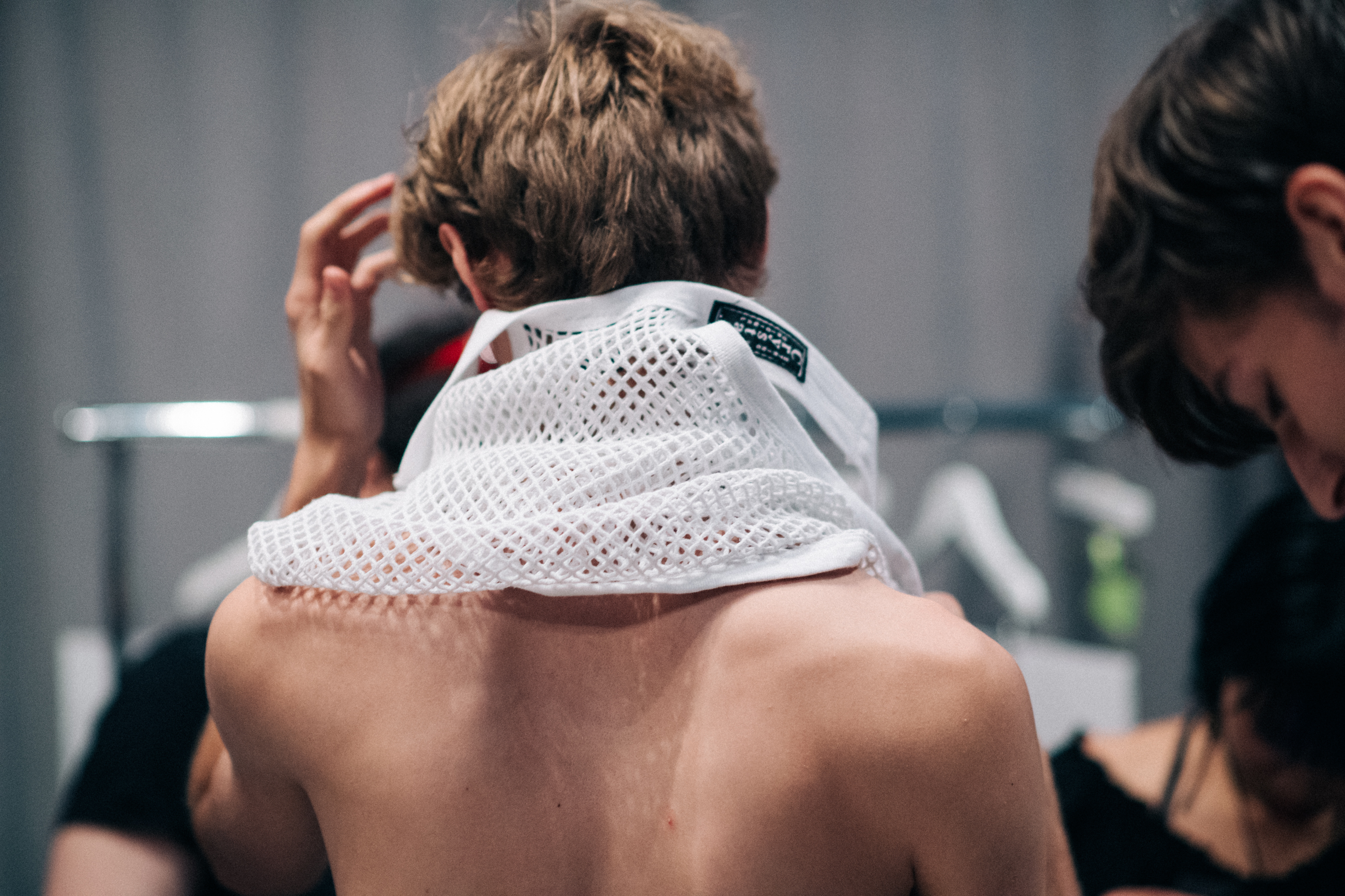Male model getting dressed in net