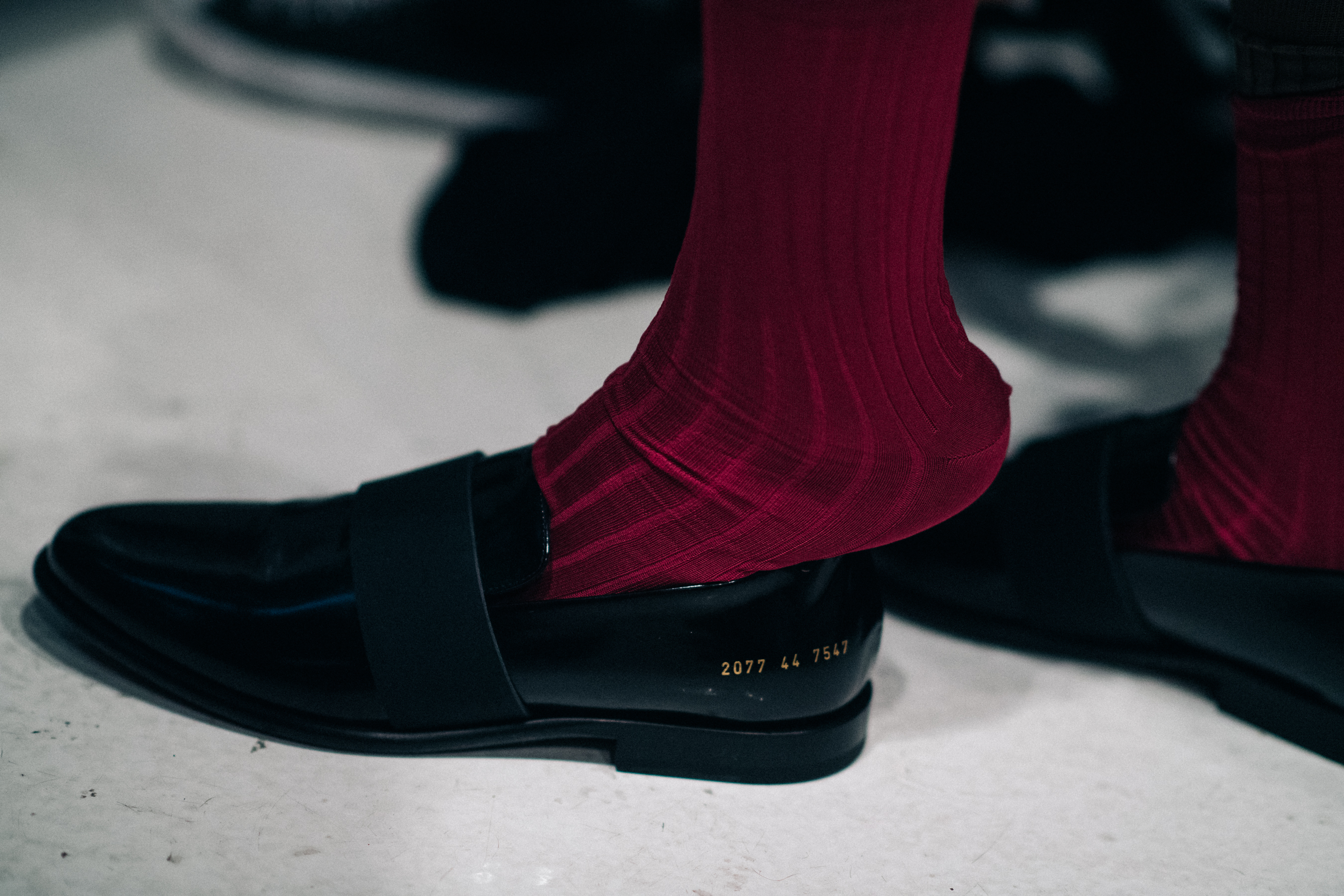 Burgundy socks and Common Projects shoes