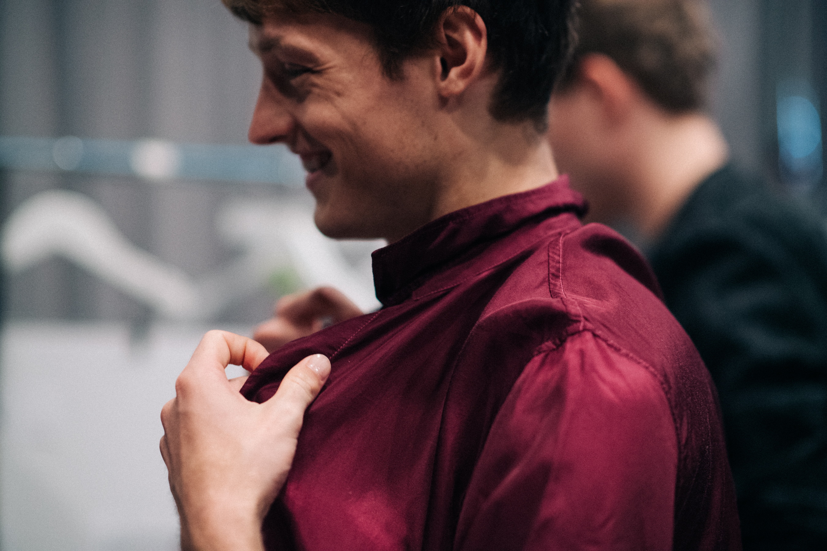 Male model wearing burgundy shirt