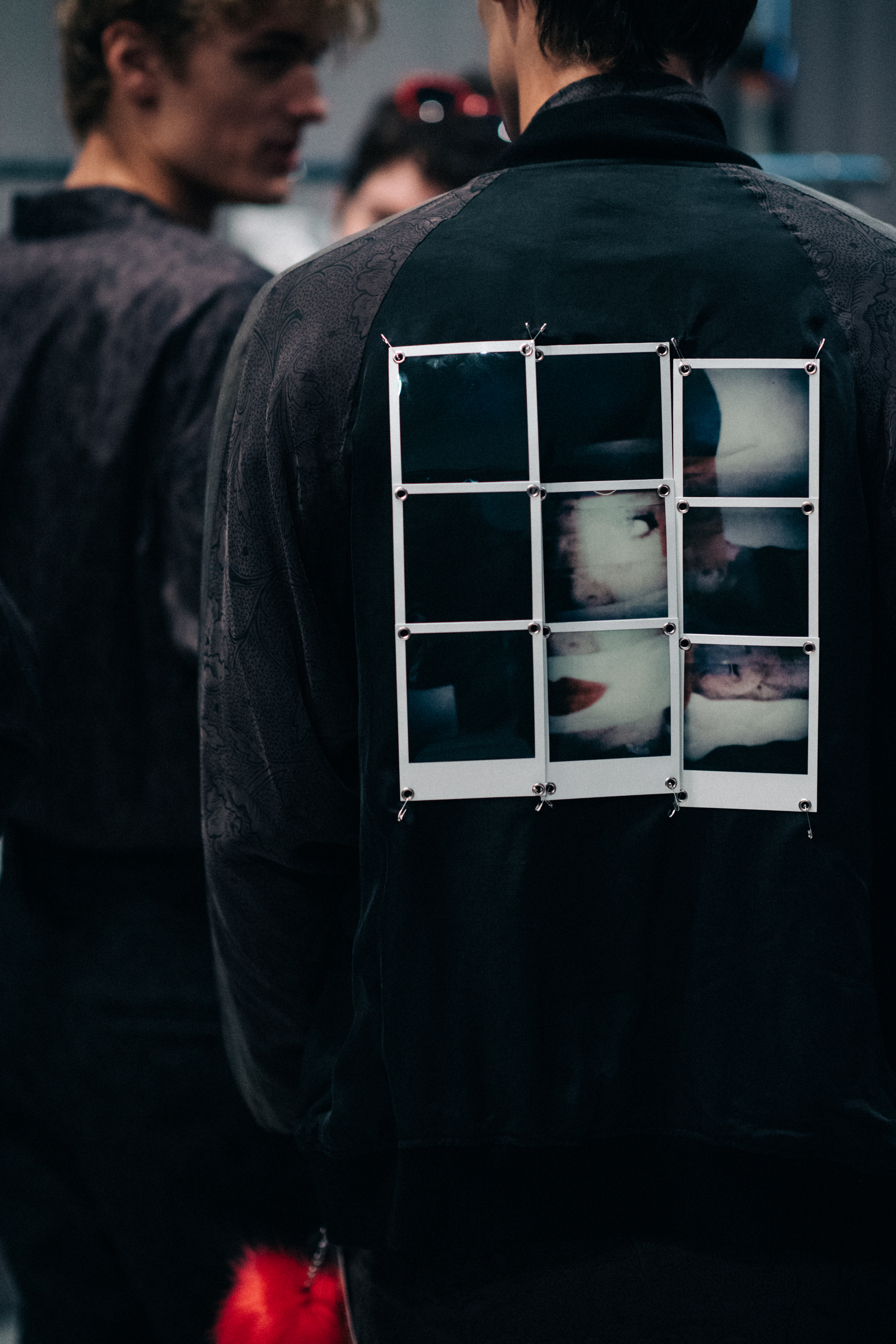 Bomber with polaroid photos attached