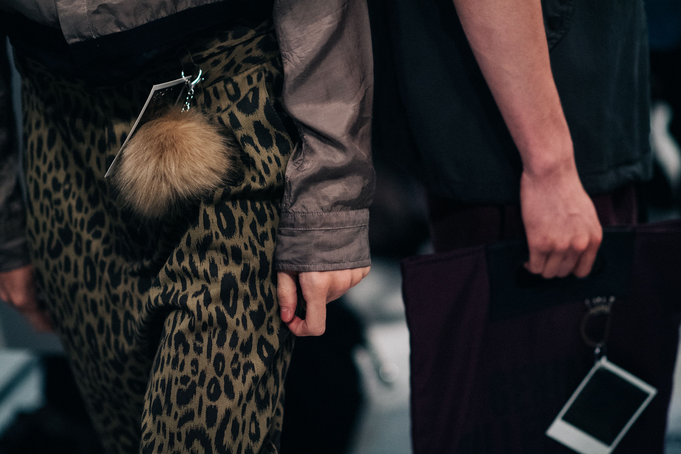 Pants with coloured fur keychains