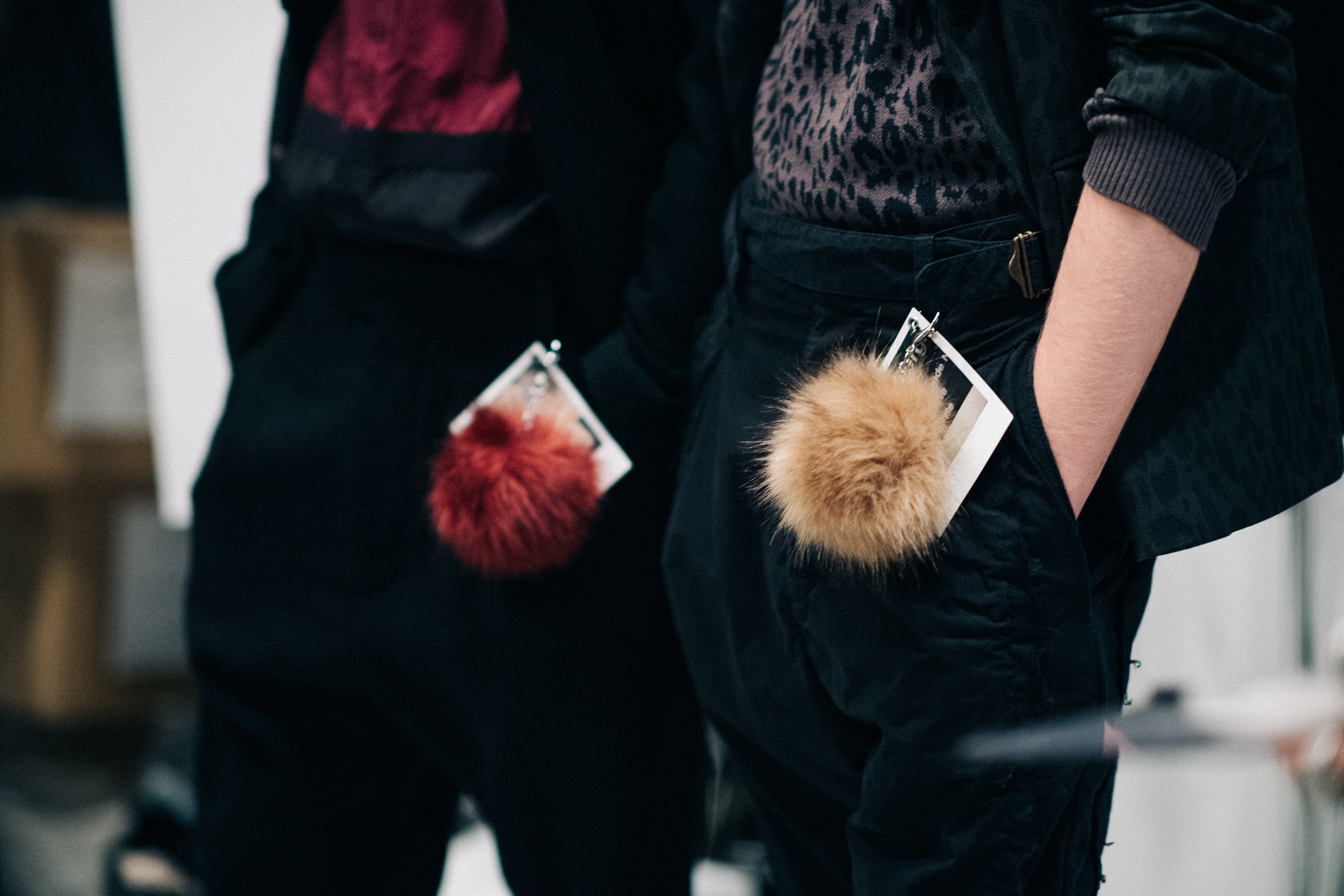 Pants with coloured fur keychains