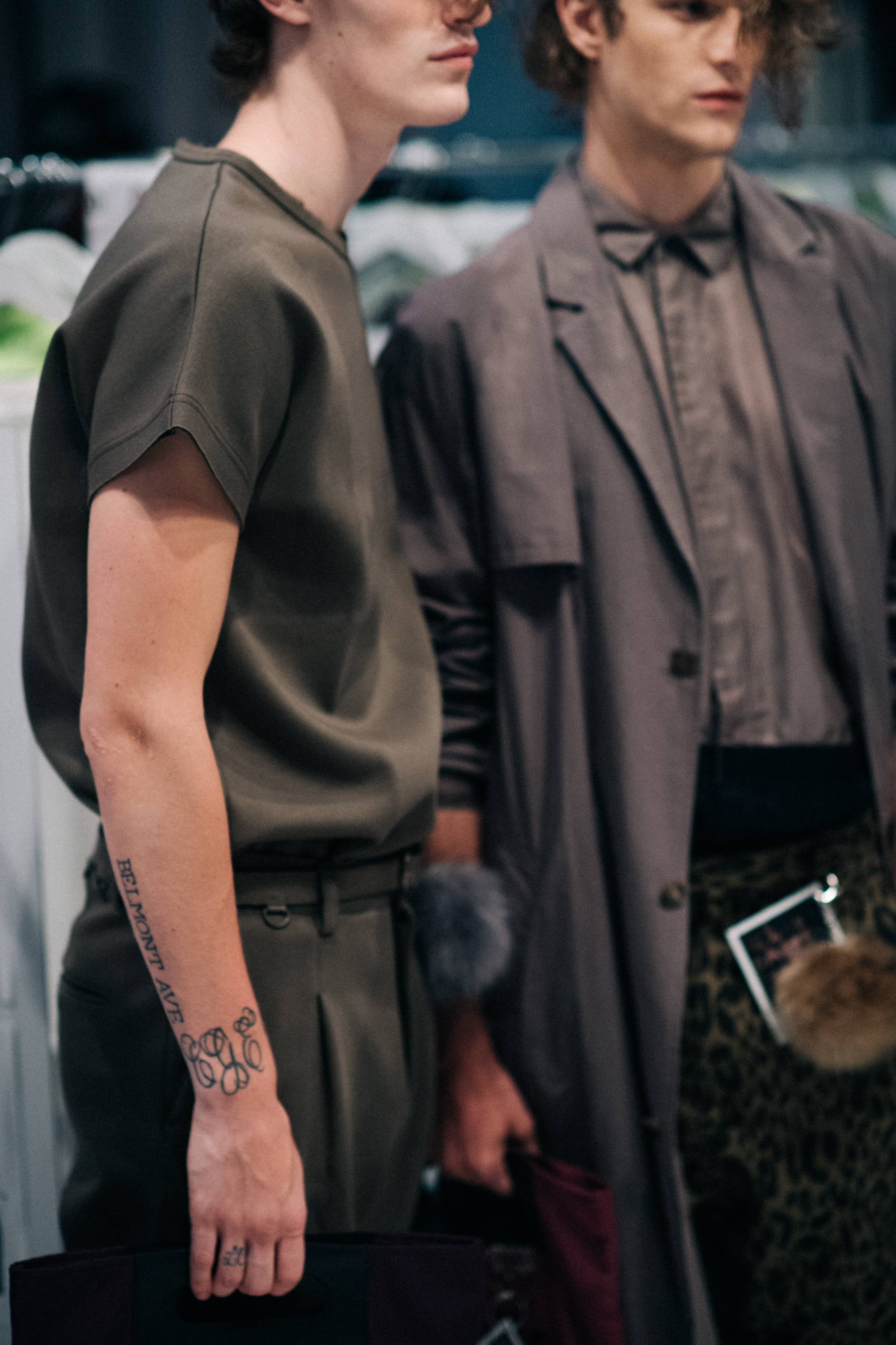 Two male models wearing grey