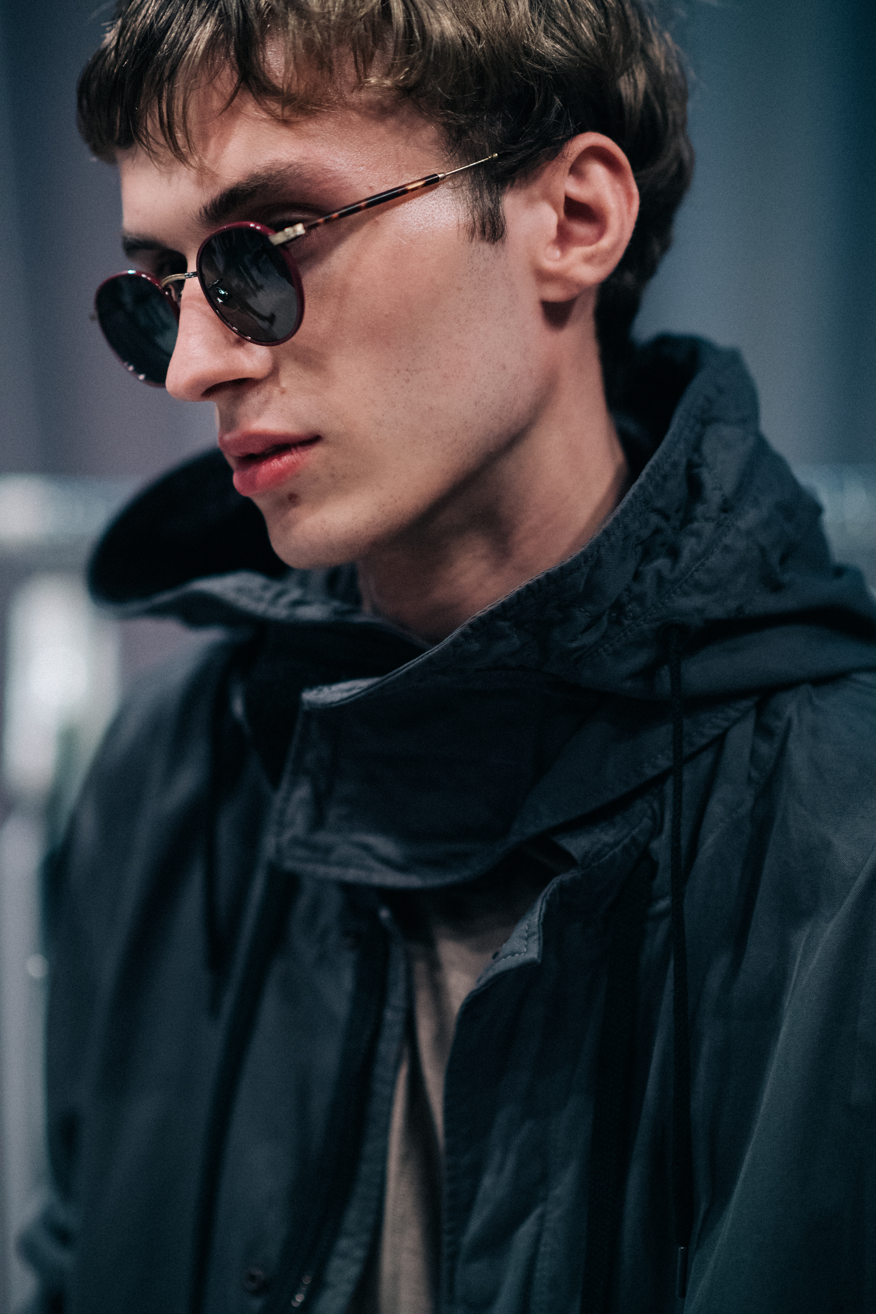 Male model wearing round glasses