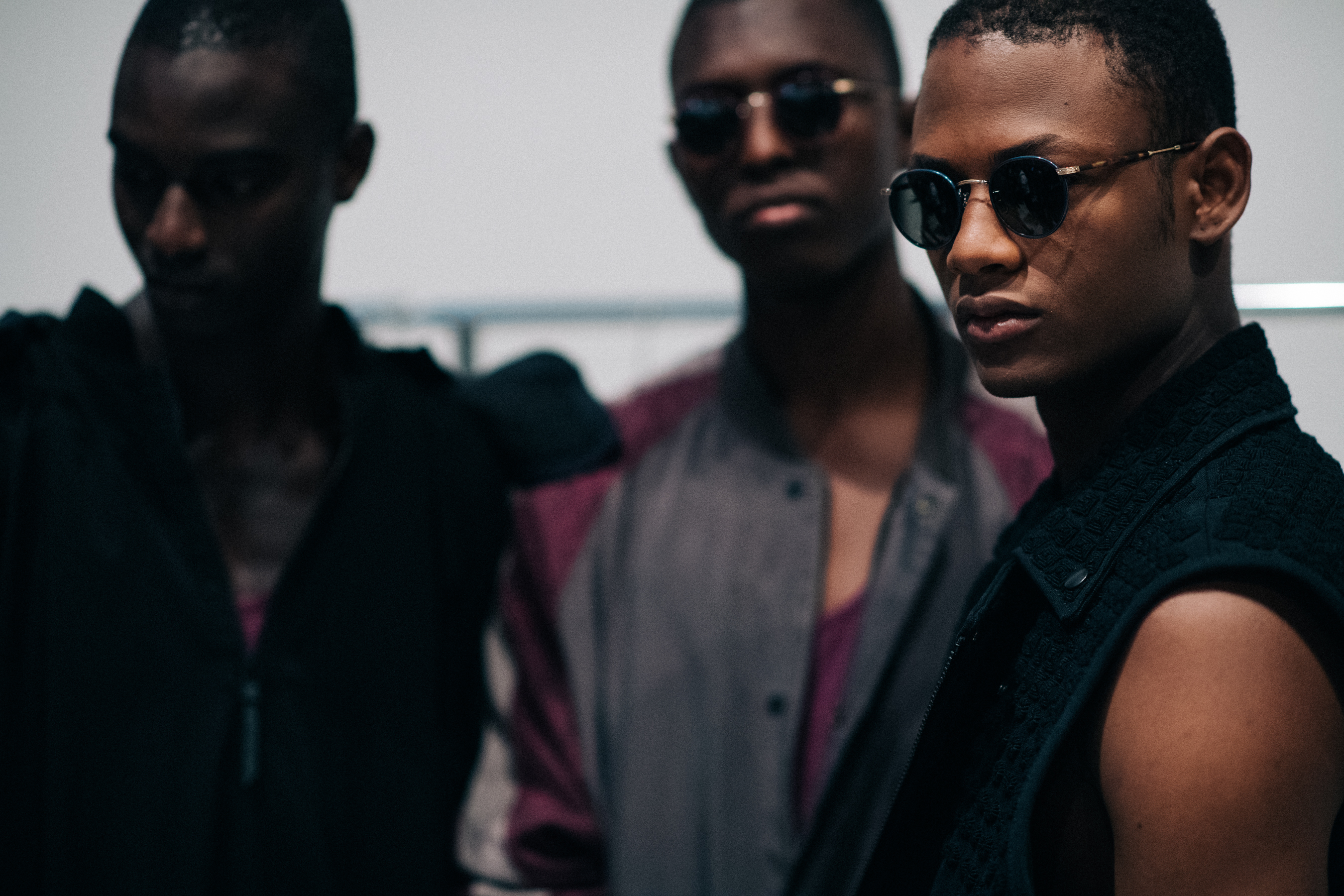 Group of male models wearing glasses