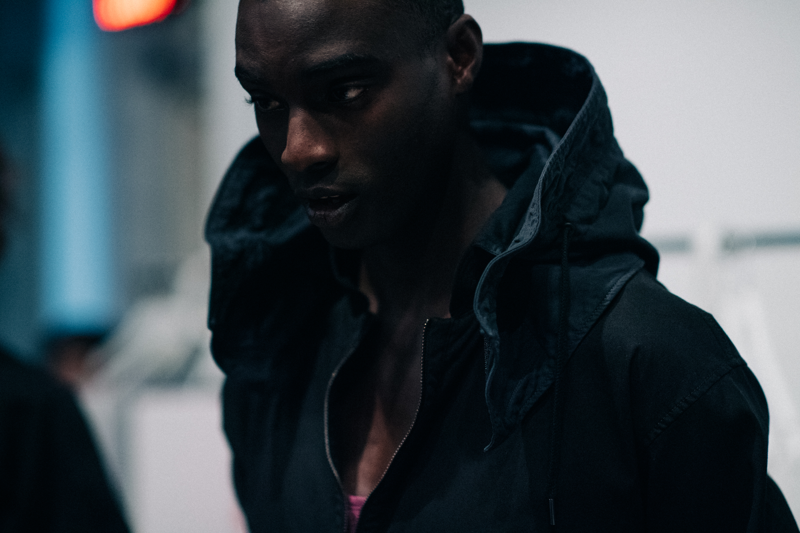 Male model wearing black hood