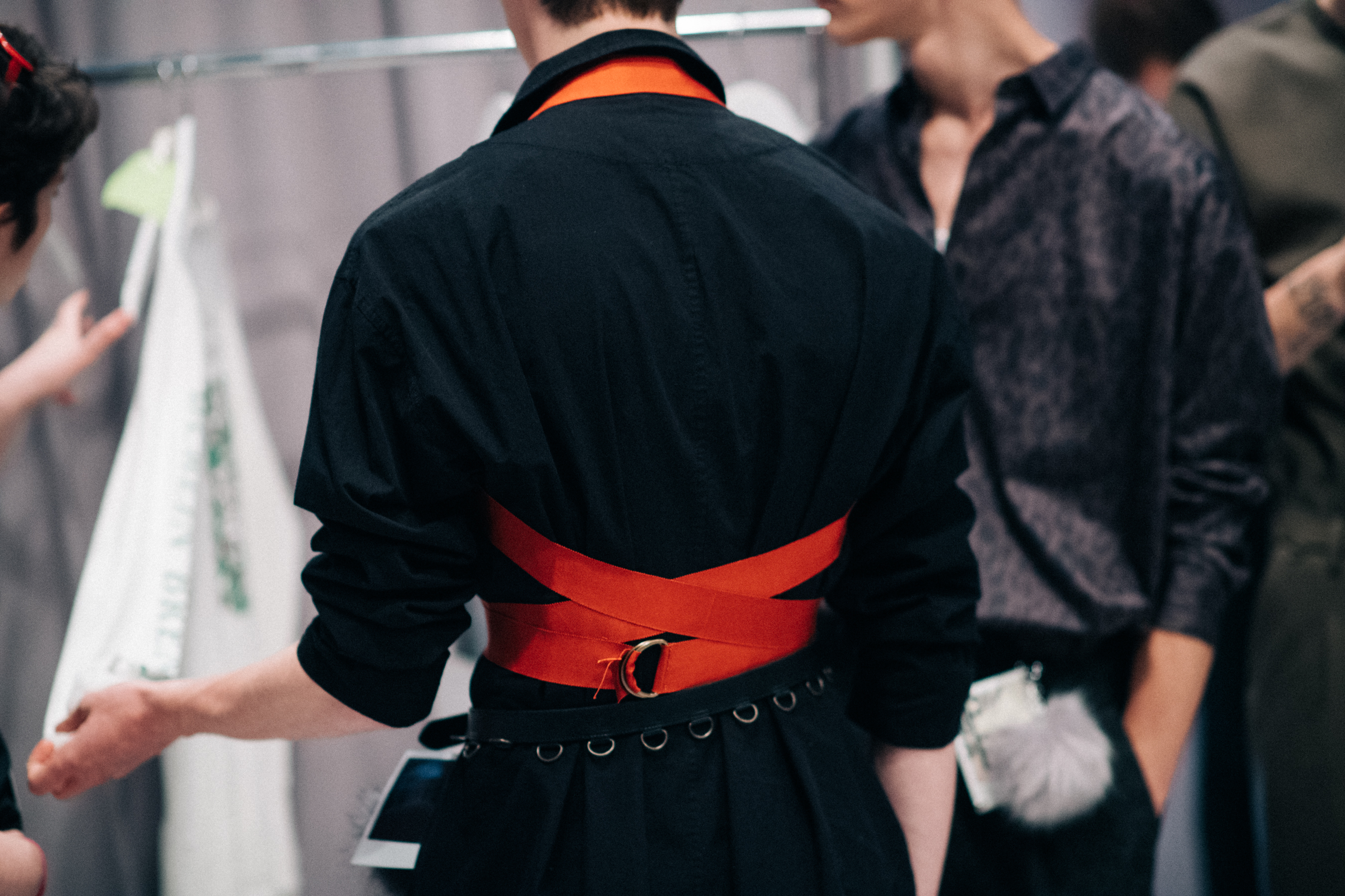 Male model wearing orange body belt