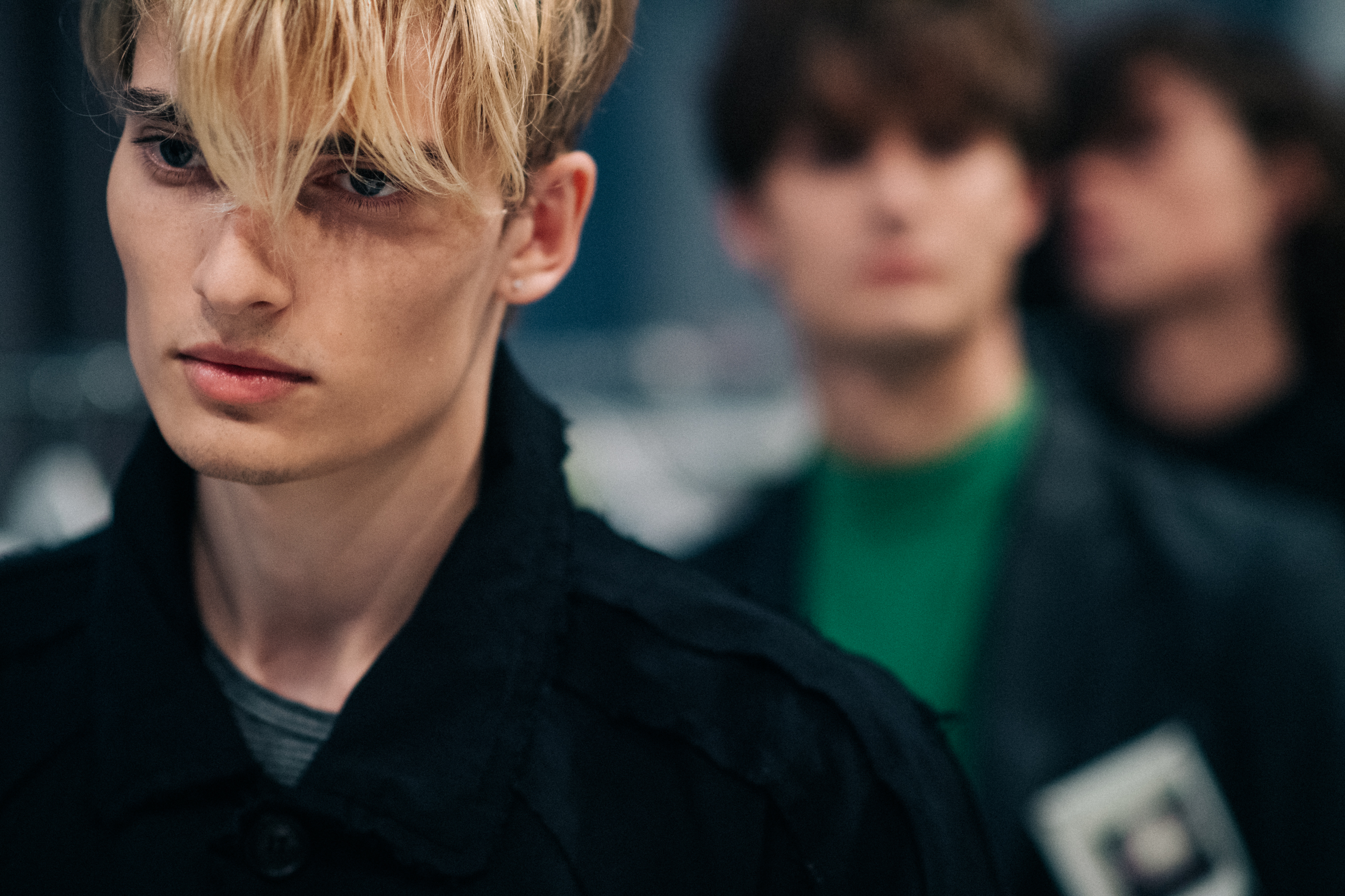 Blonde male model before show