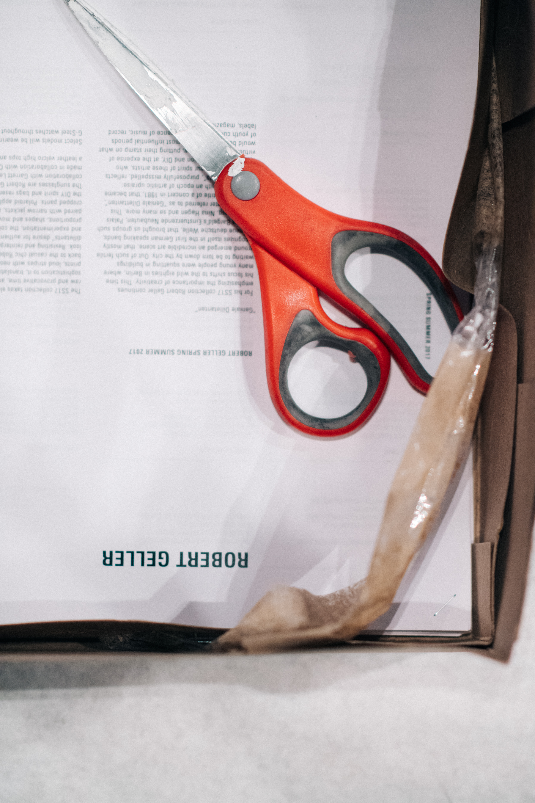 Orange scissors and press release