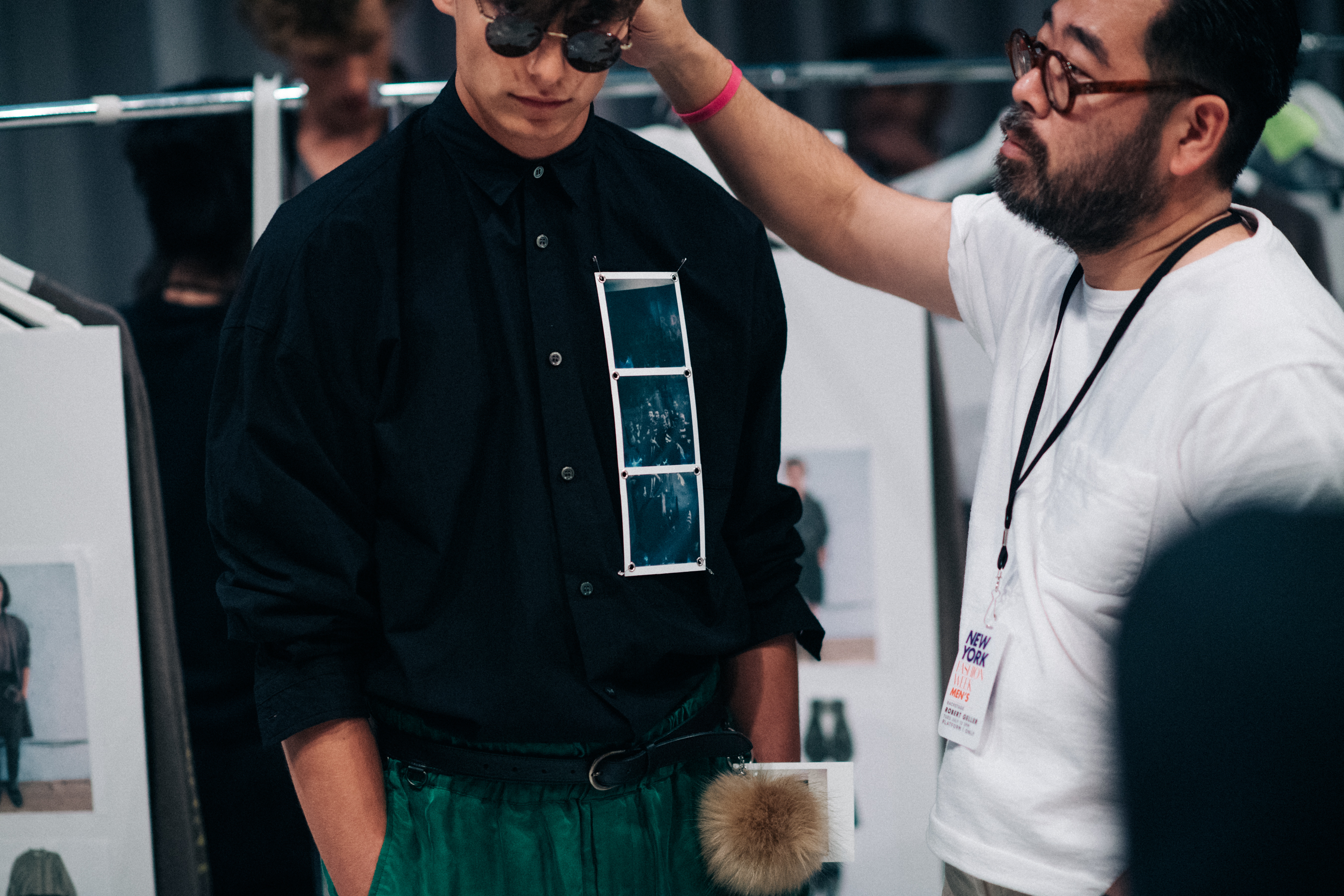 Male model getting dressed