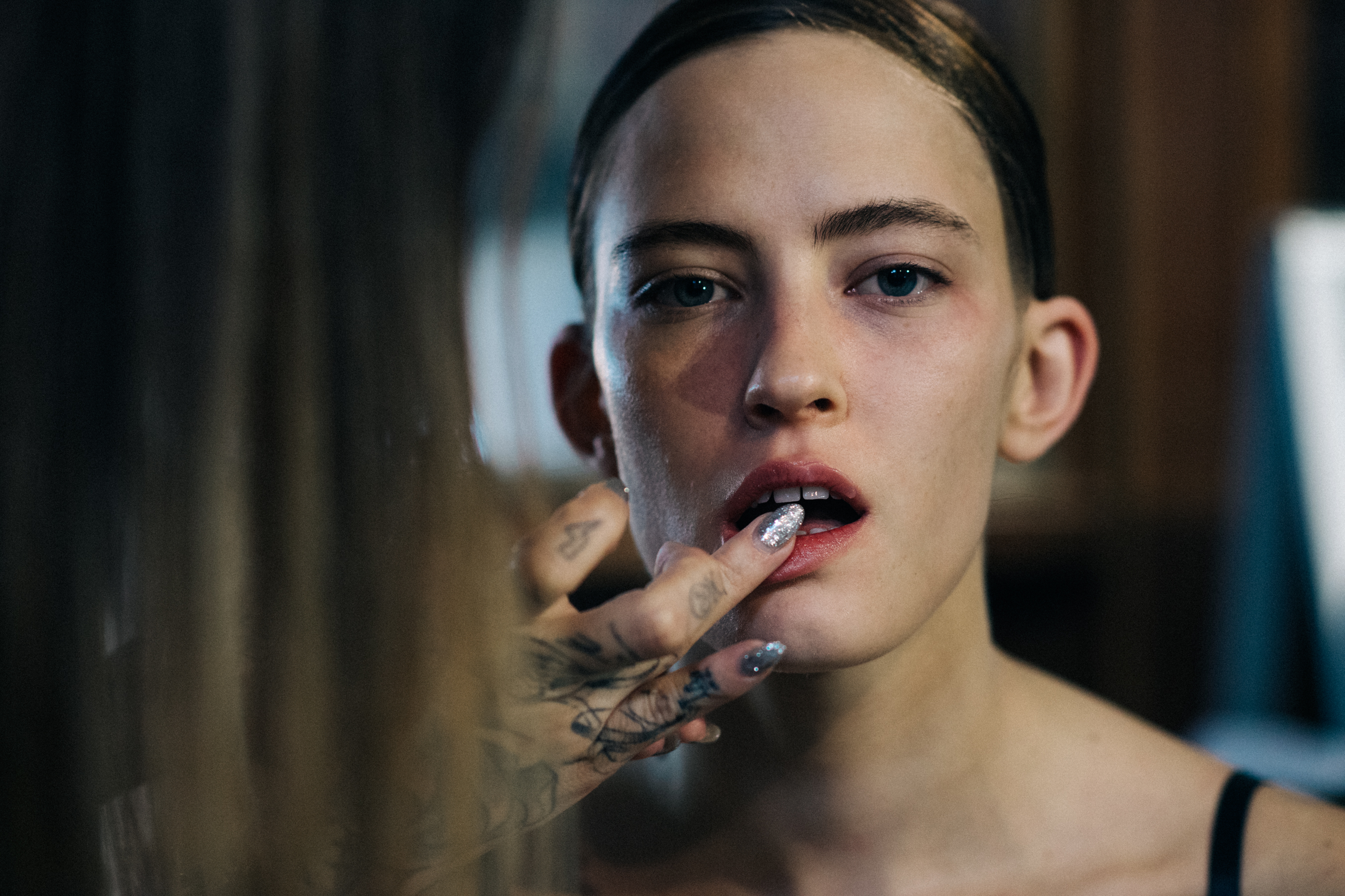 Model getting lip make up done