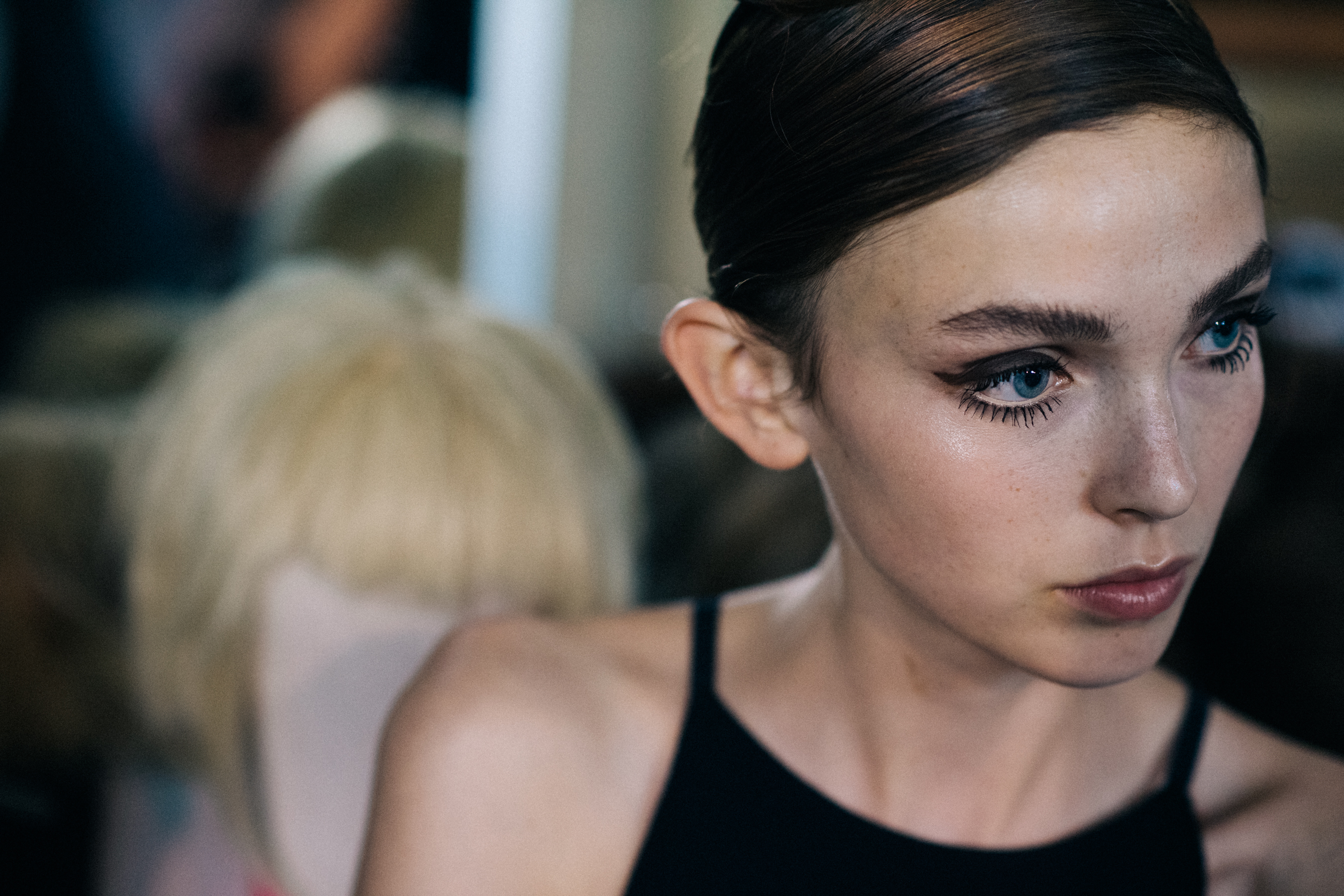 Model with sleek hair before show
