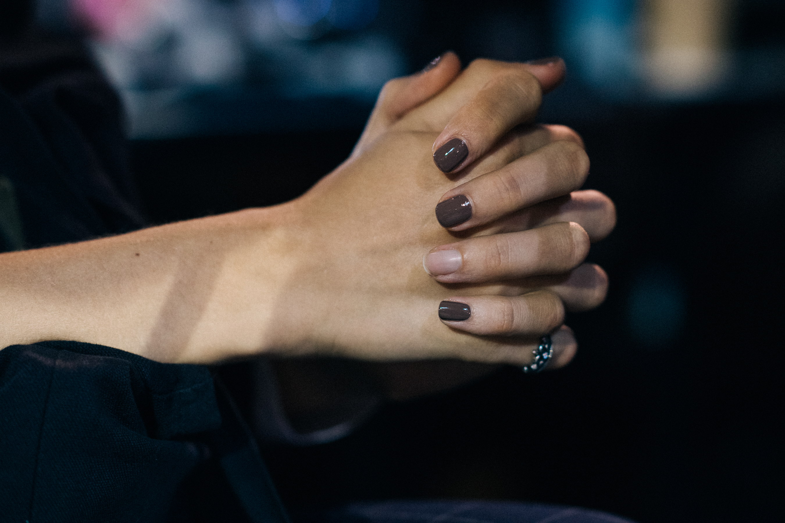 Model with brown nail polish