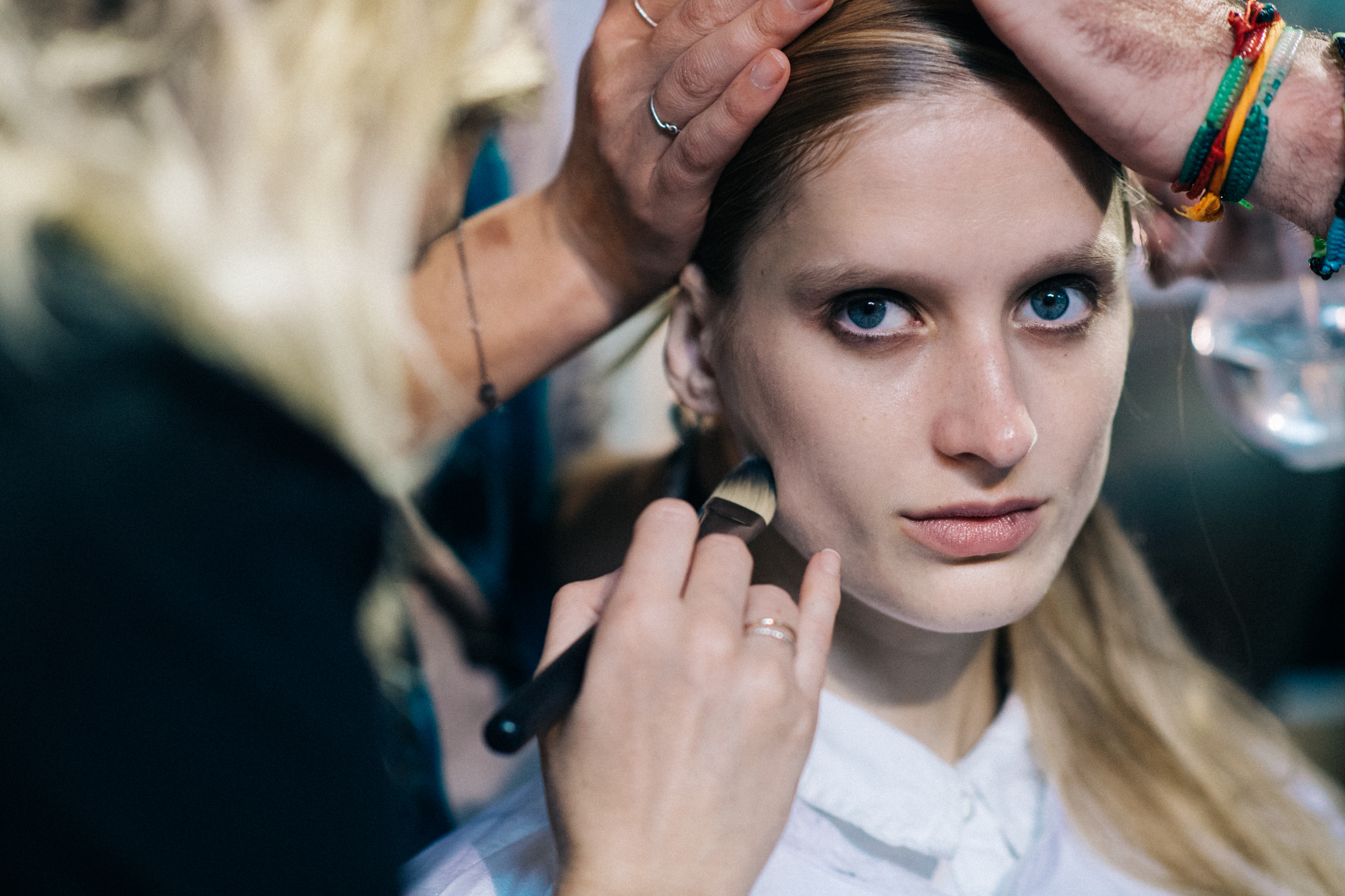 Model getting make up and hair done