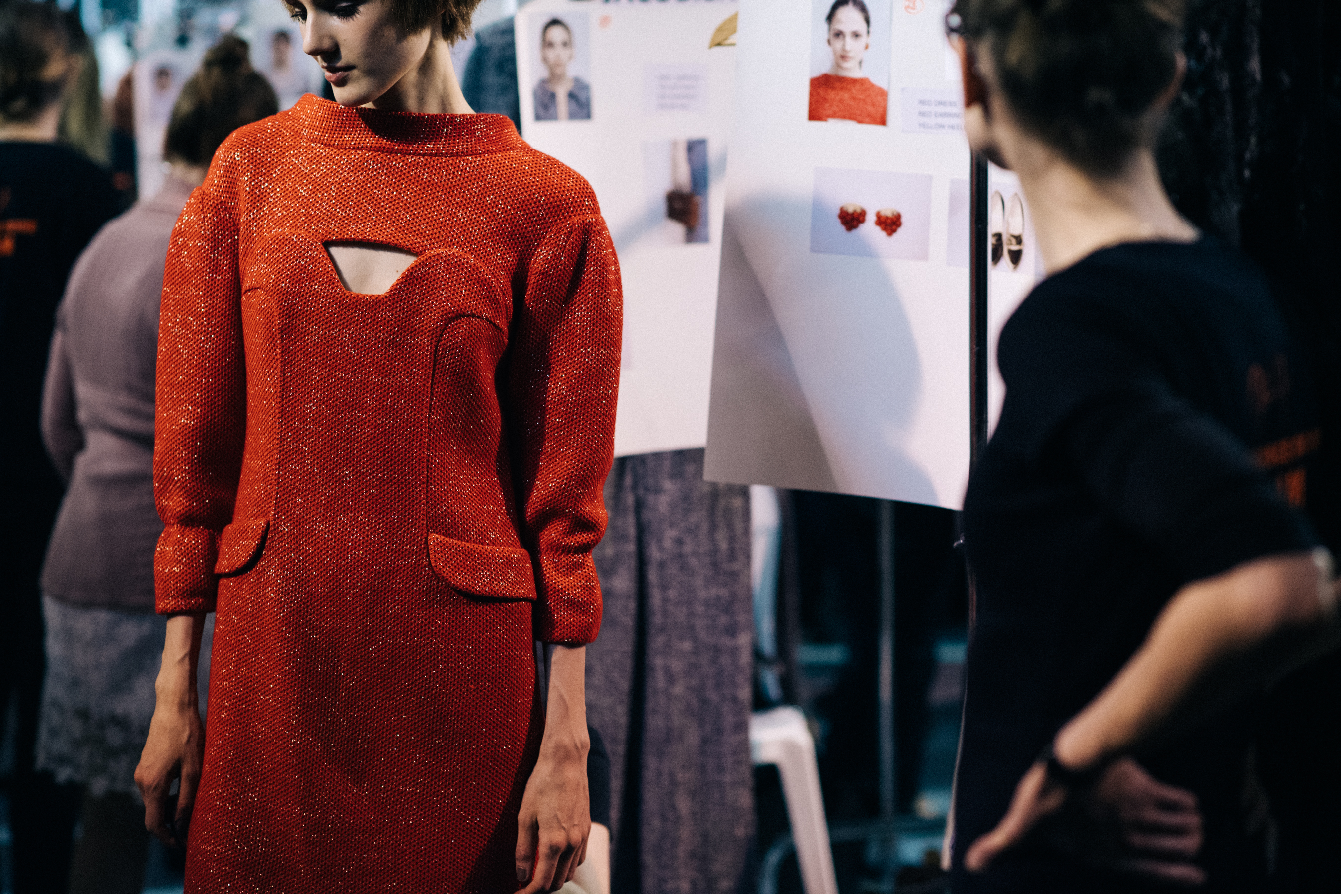 Model wearing red couture dress