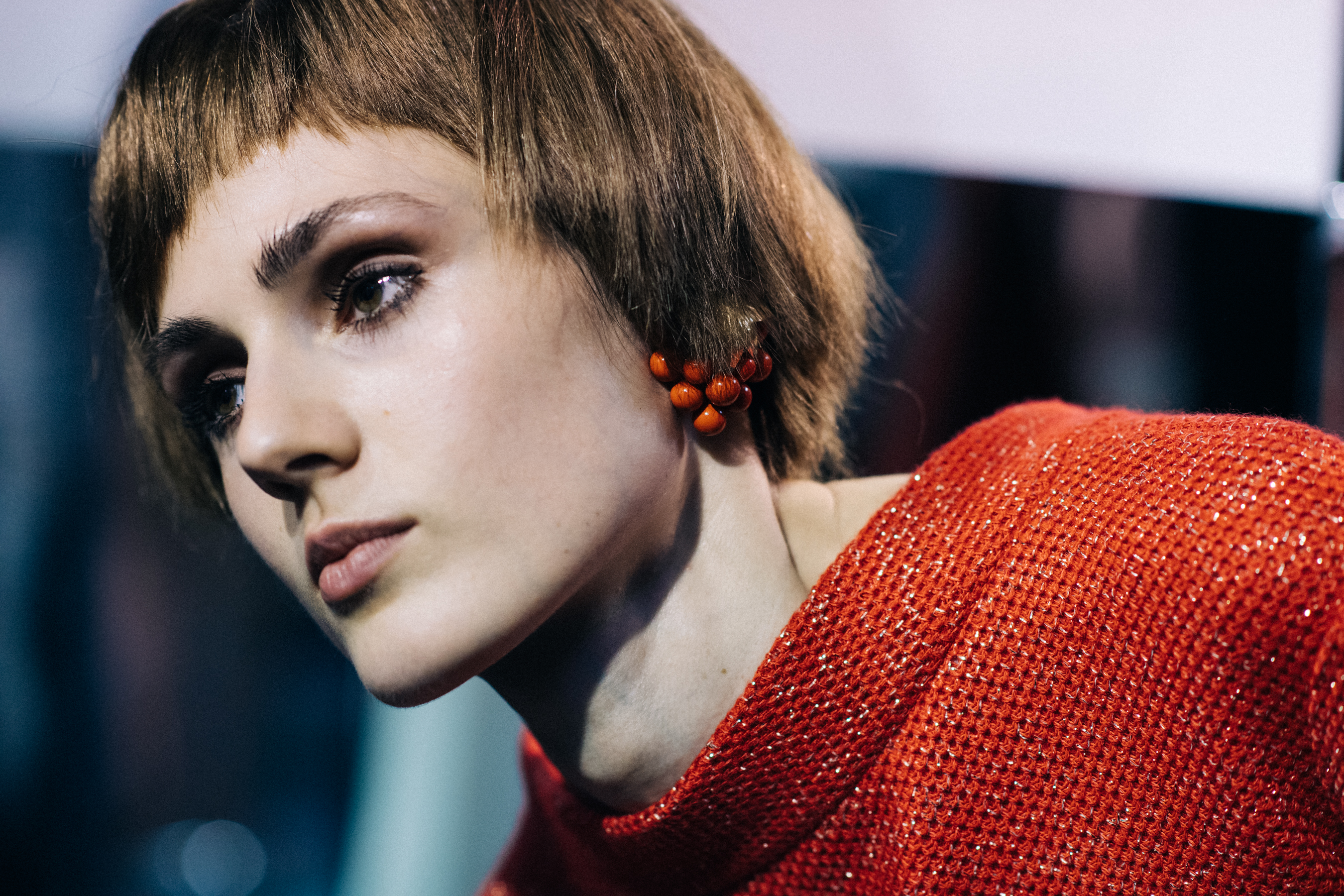 Model wearing red berry earrings