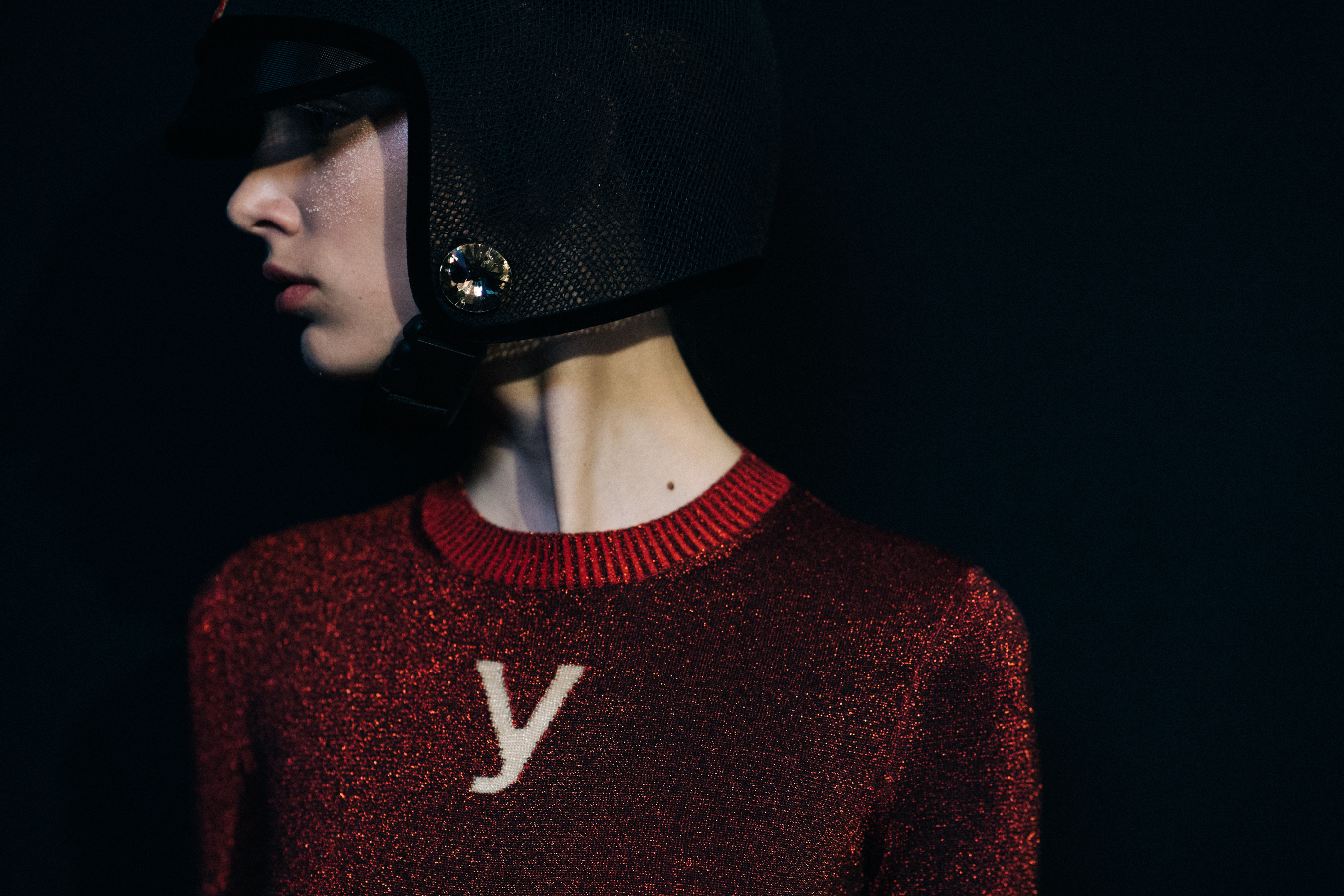 Model wearing couture helmet with crystal