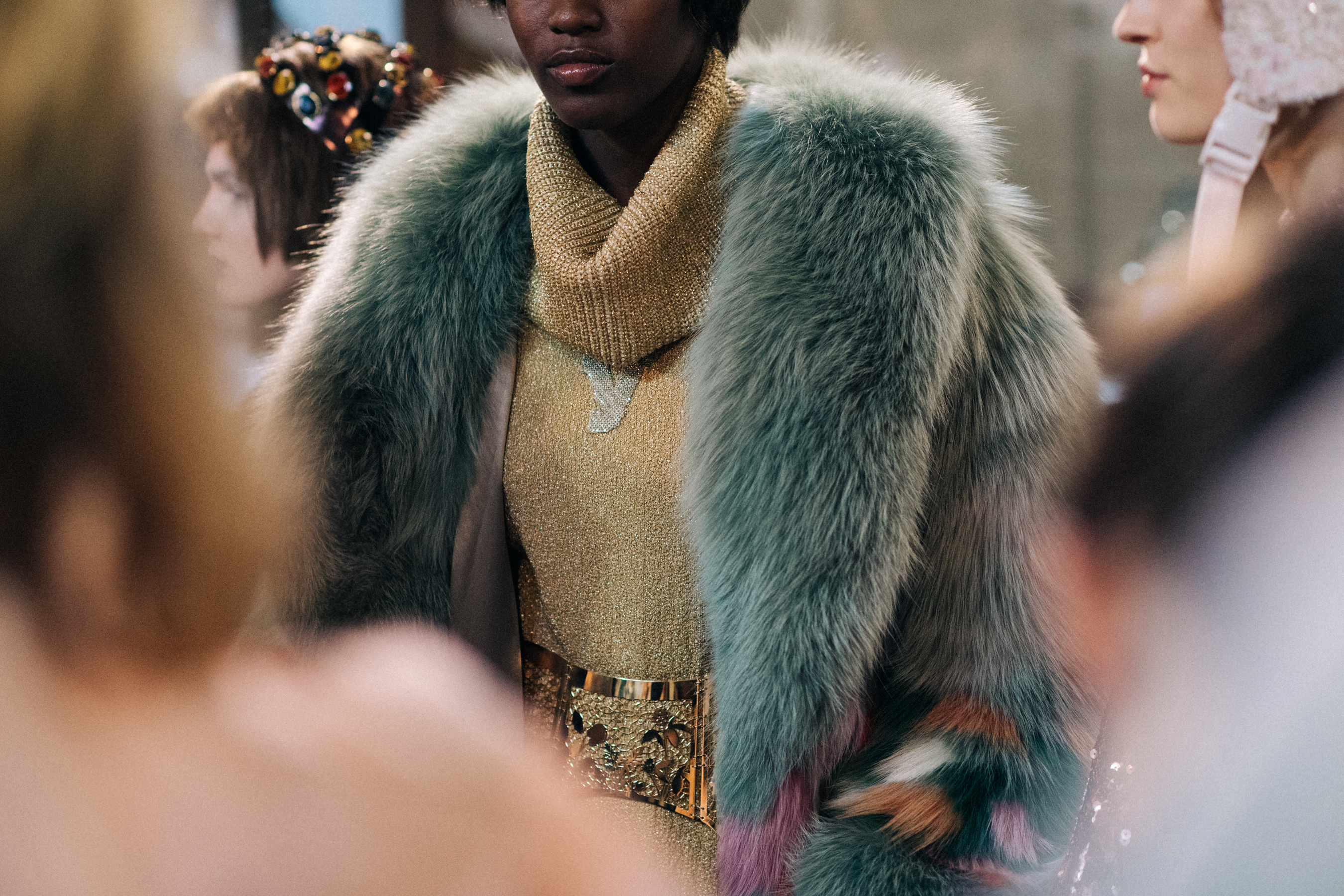 Model wearing coloured fur jacket