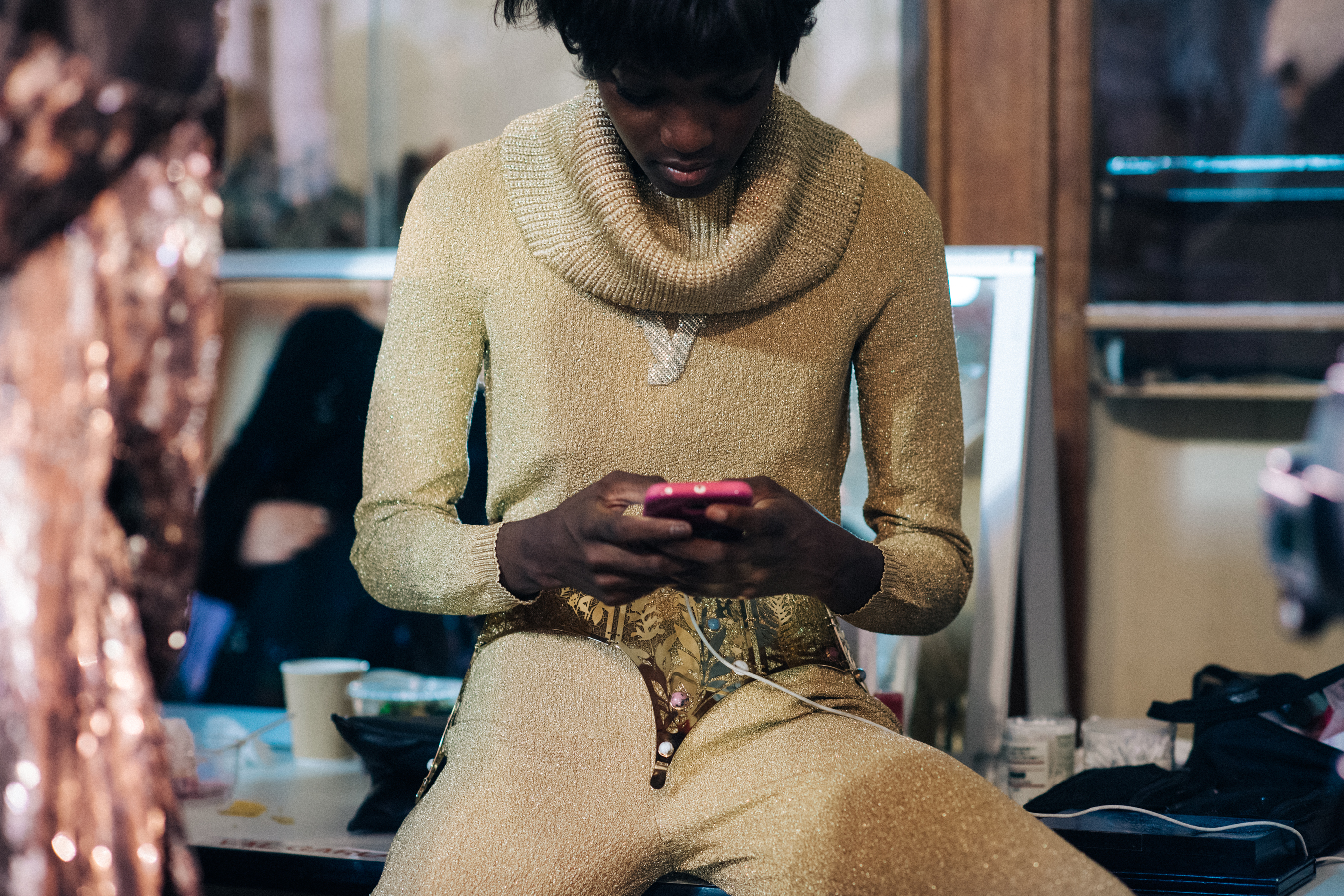Model wearing golden couture jumpsuit