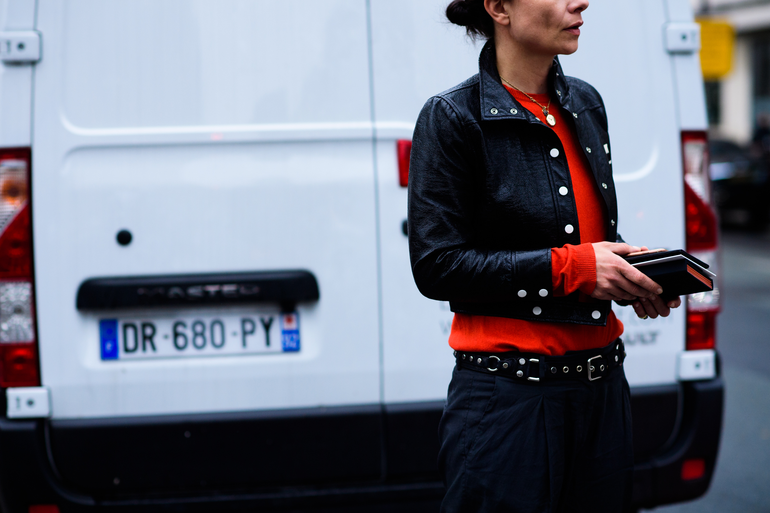 Woman wearing bright orange sweater