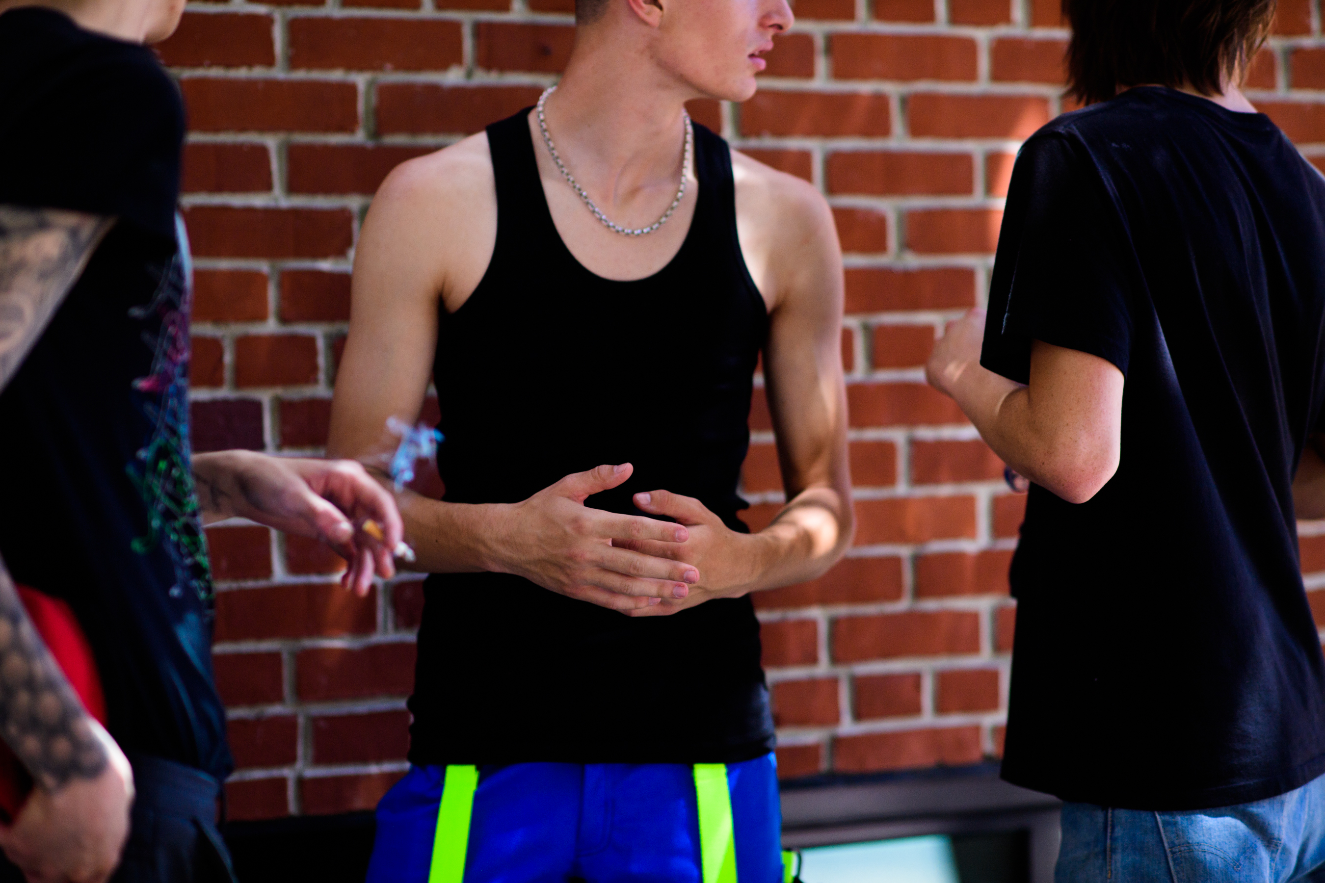 Male model wearing blue track pants