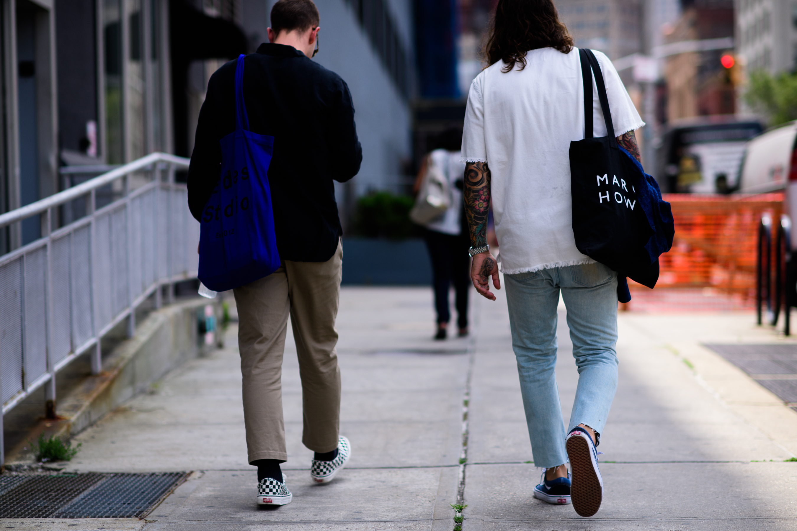Two menswear buyers wearing Vans