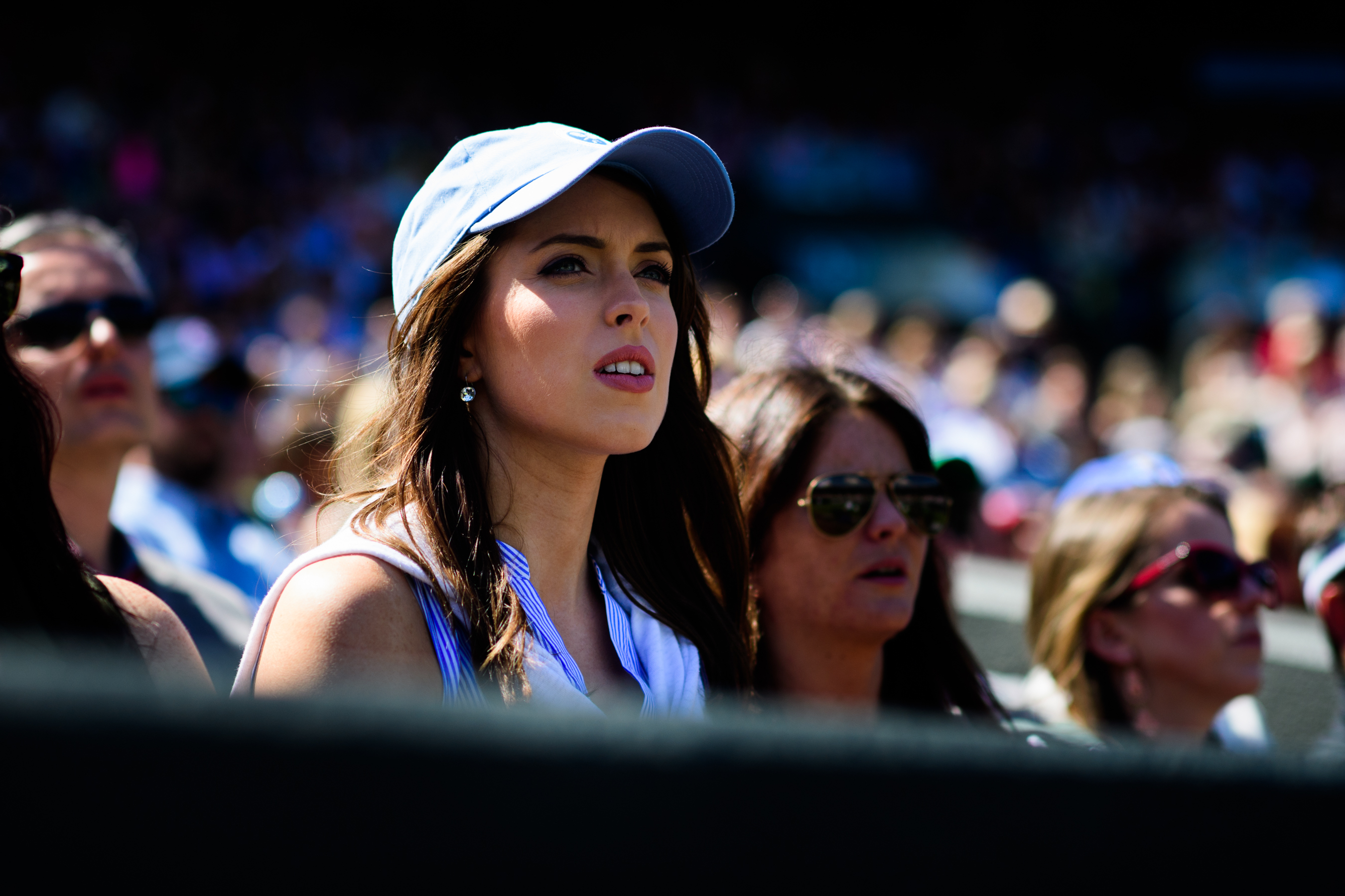 Pretty woman watching tennis tournament
