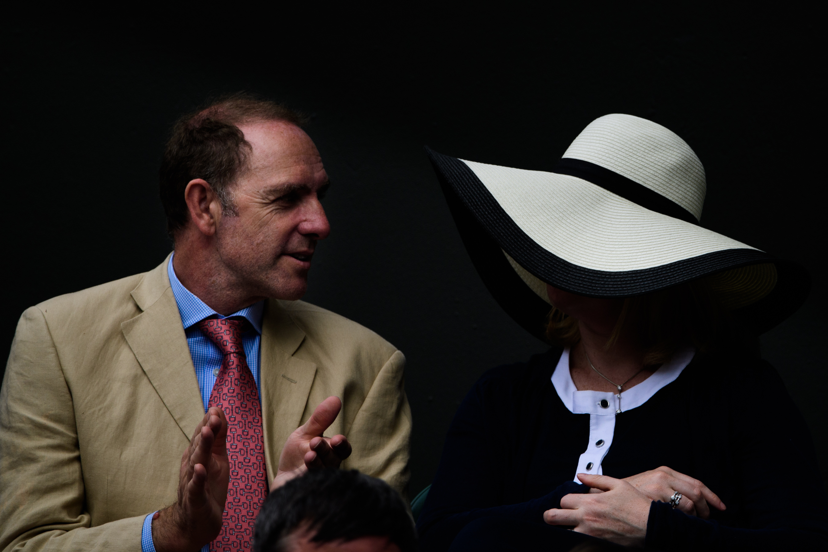 Man and woman wearing big hat