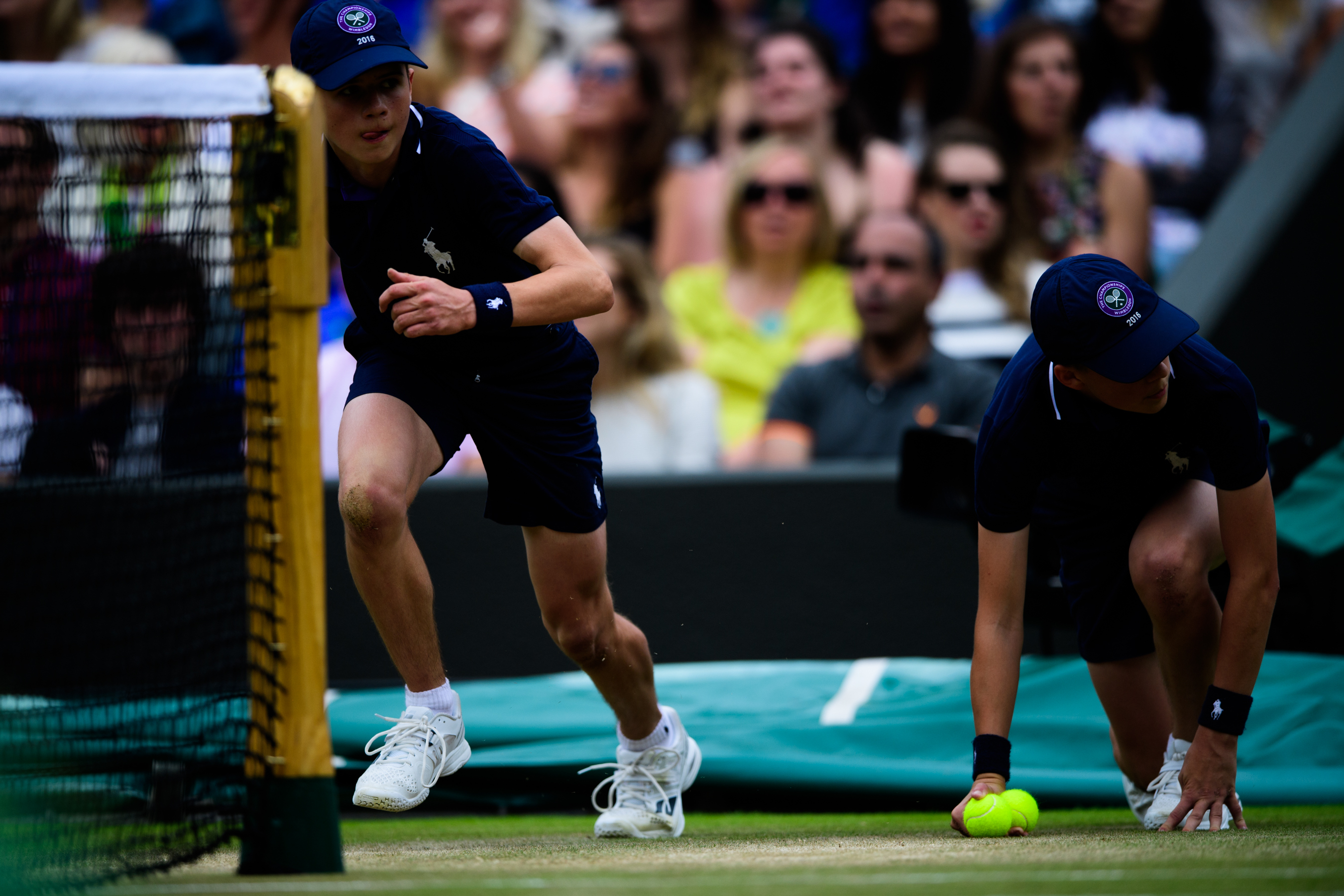 Boys running on the tennis court