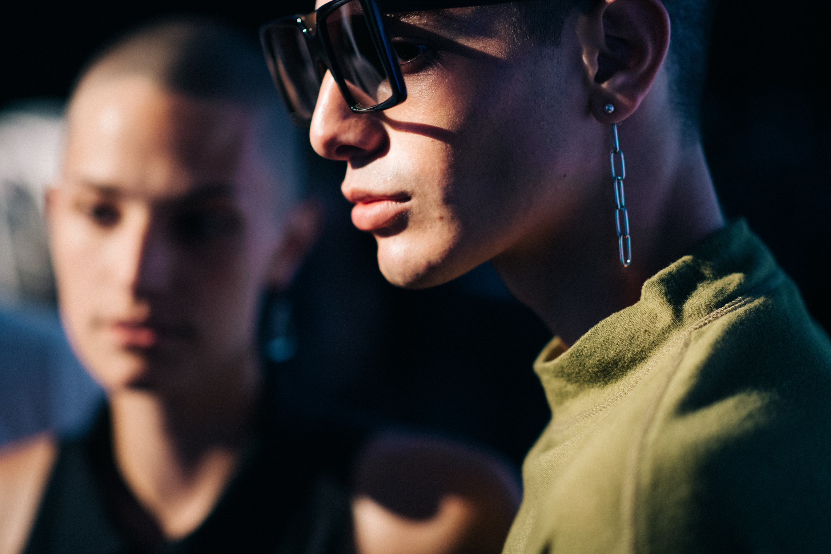 Male model wearing long earring