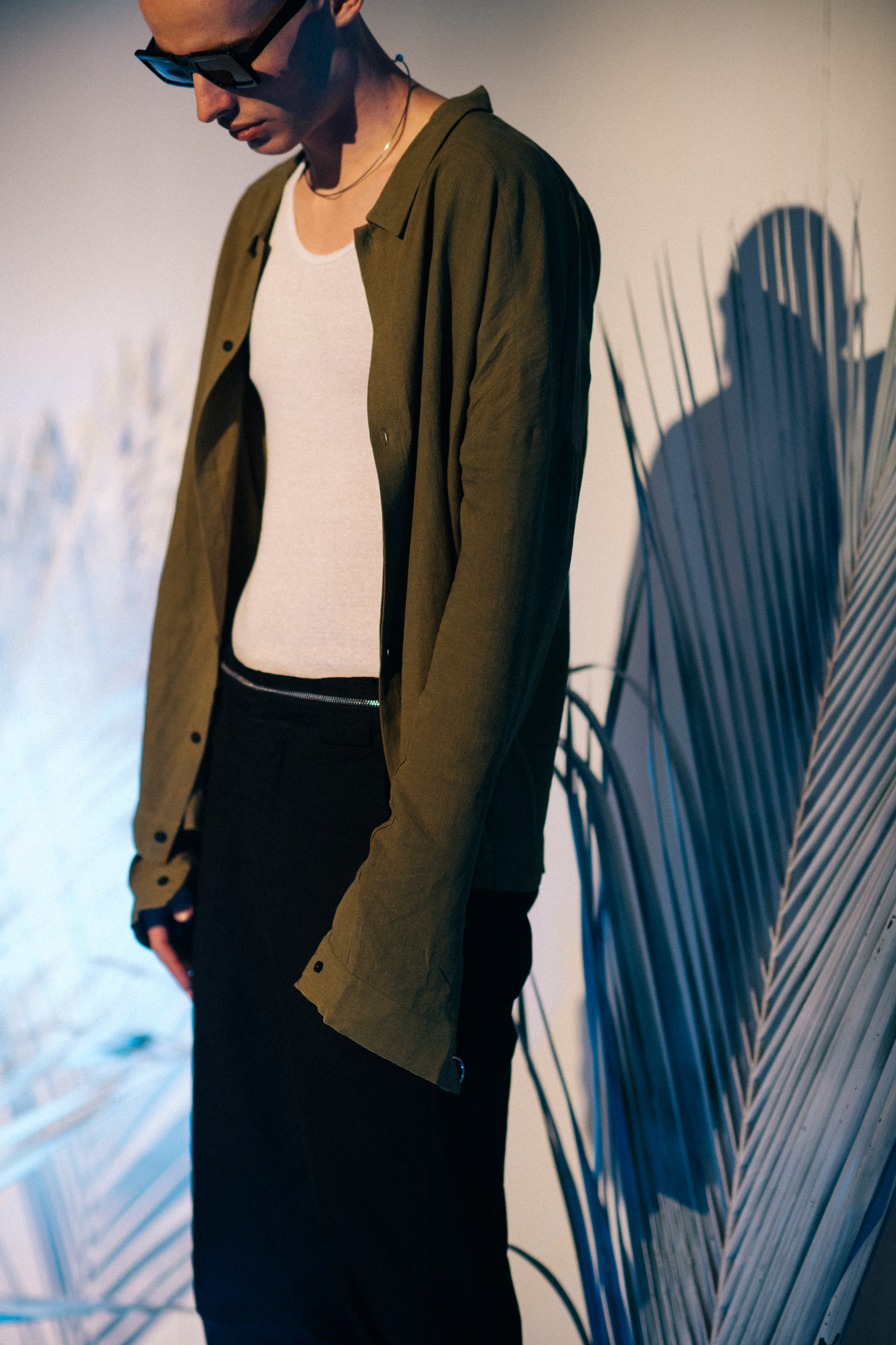 Male model wearing earth green shirt