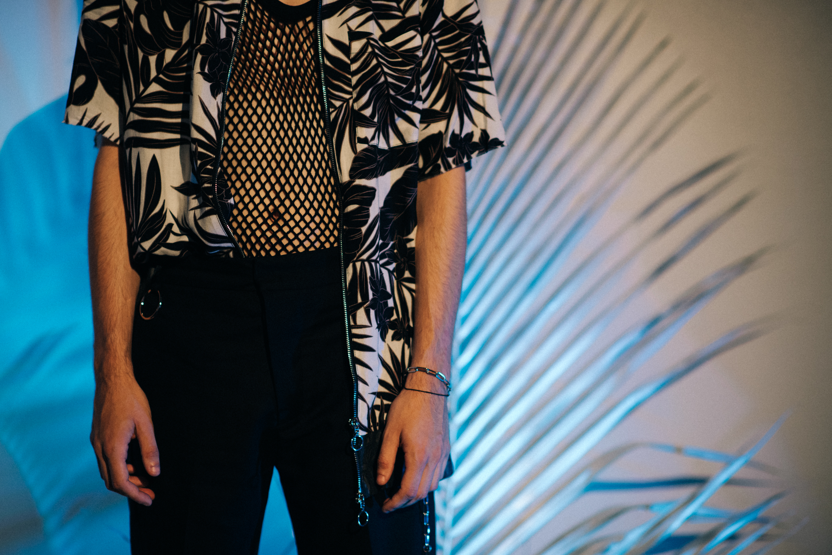 Male model wearing palm tree shirt