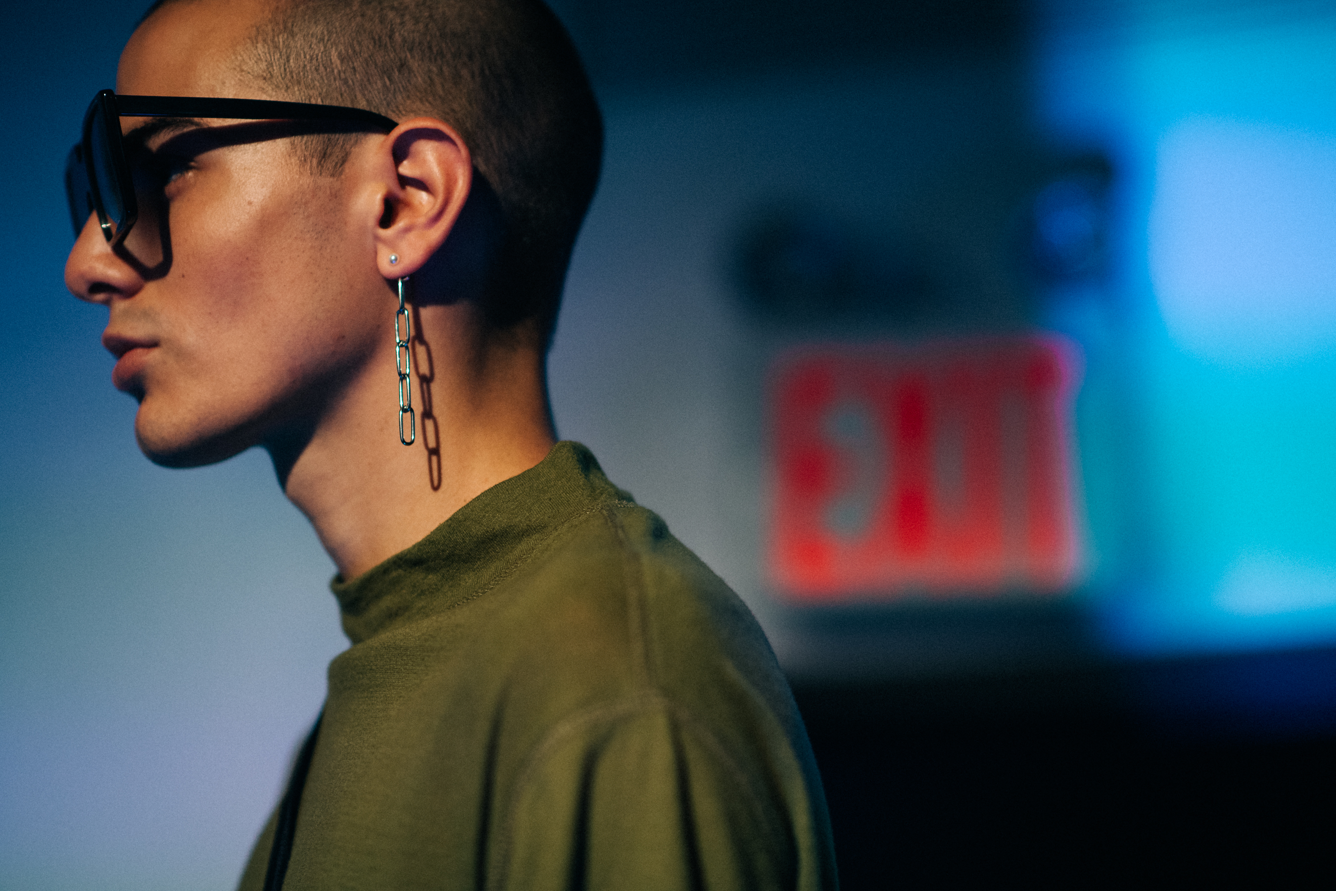 Male model wearing long earring