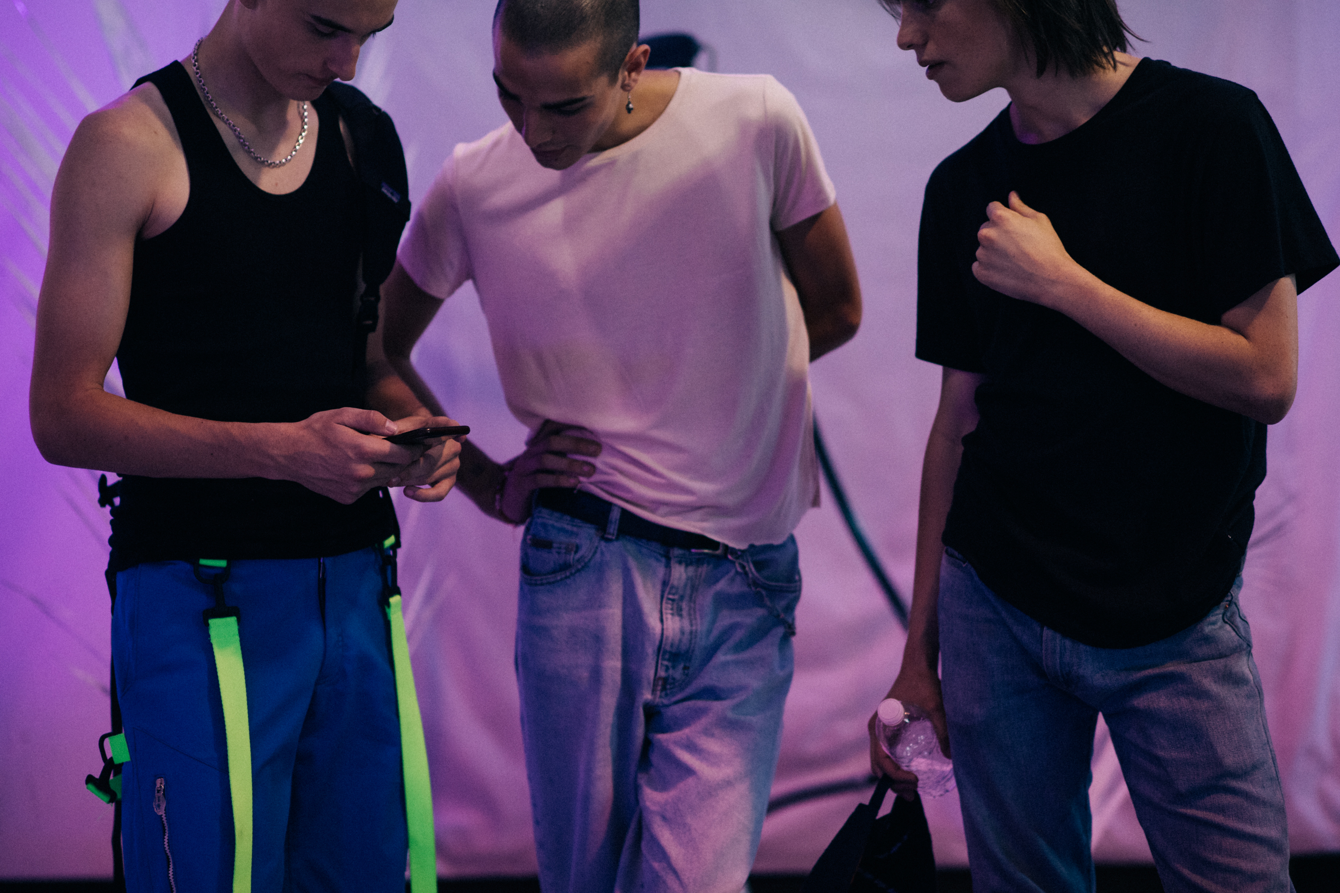 Group of male models in pink light