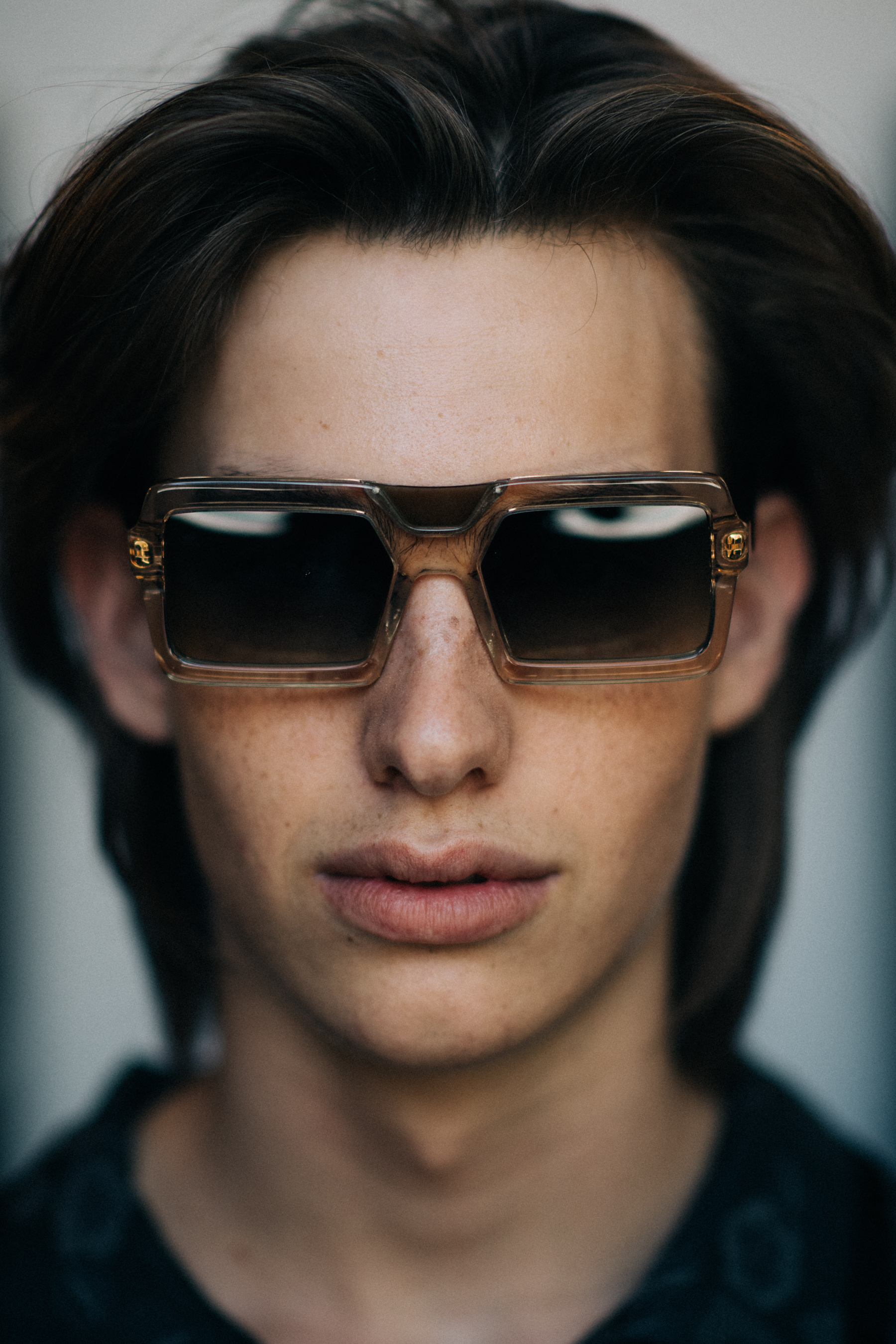 Portrait of a male model 90s glasses