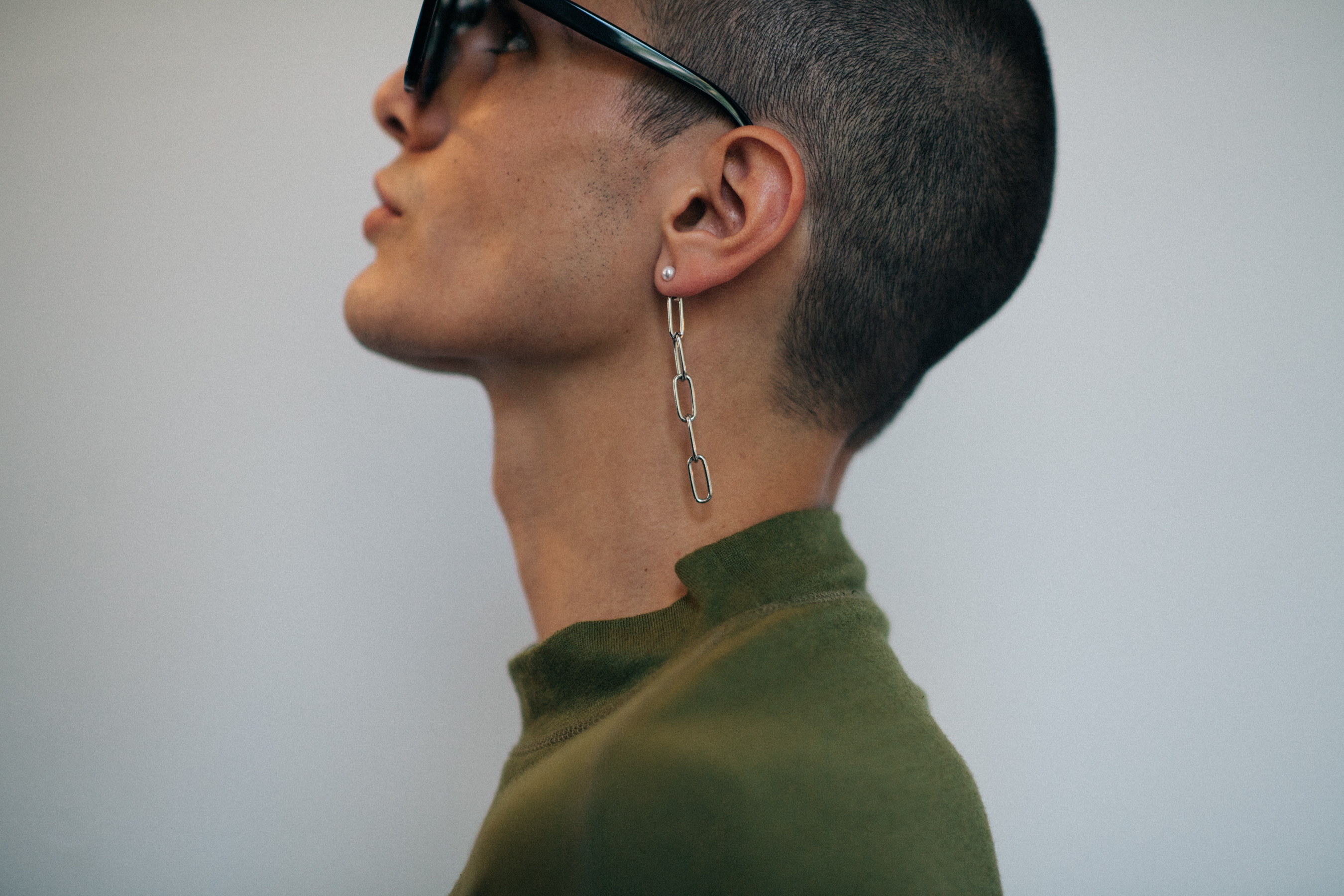 Male model wearing long earring