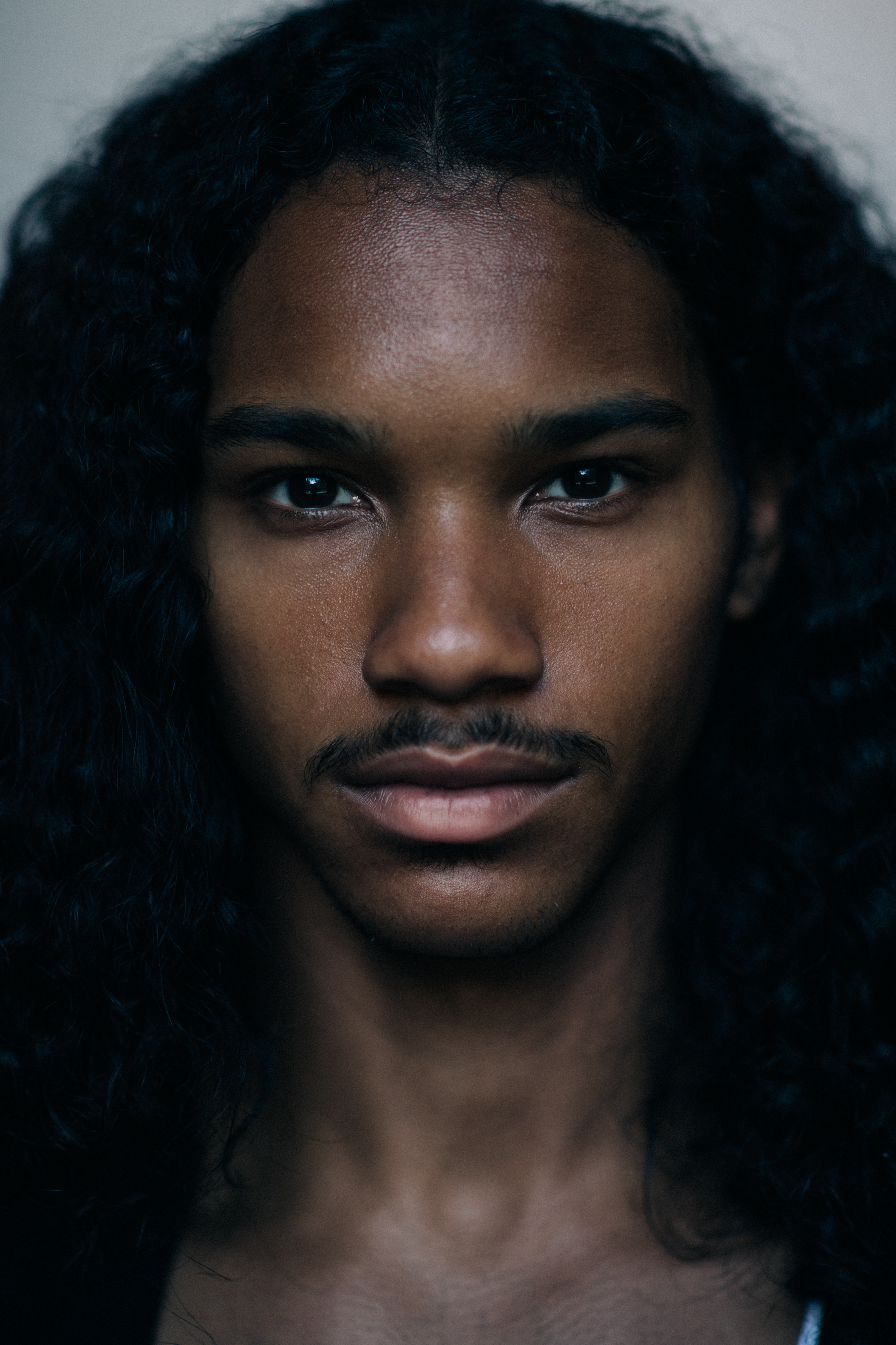 Portrait of male model with long hair