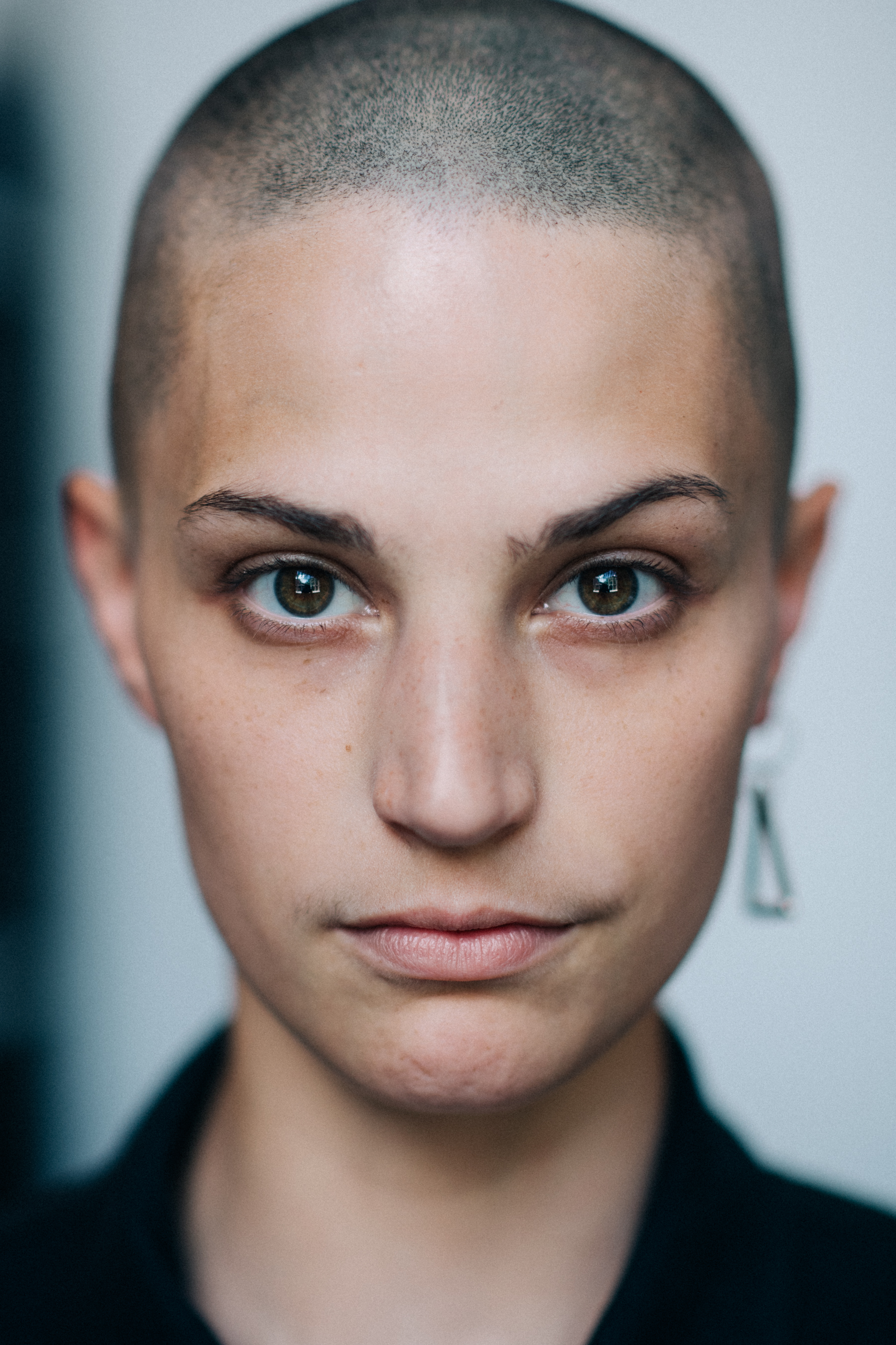 Portrait of a shaved head female model