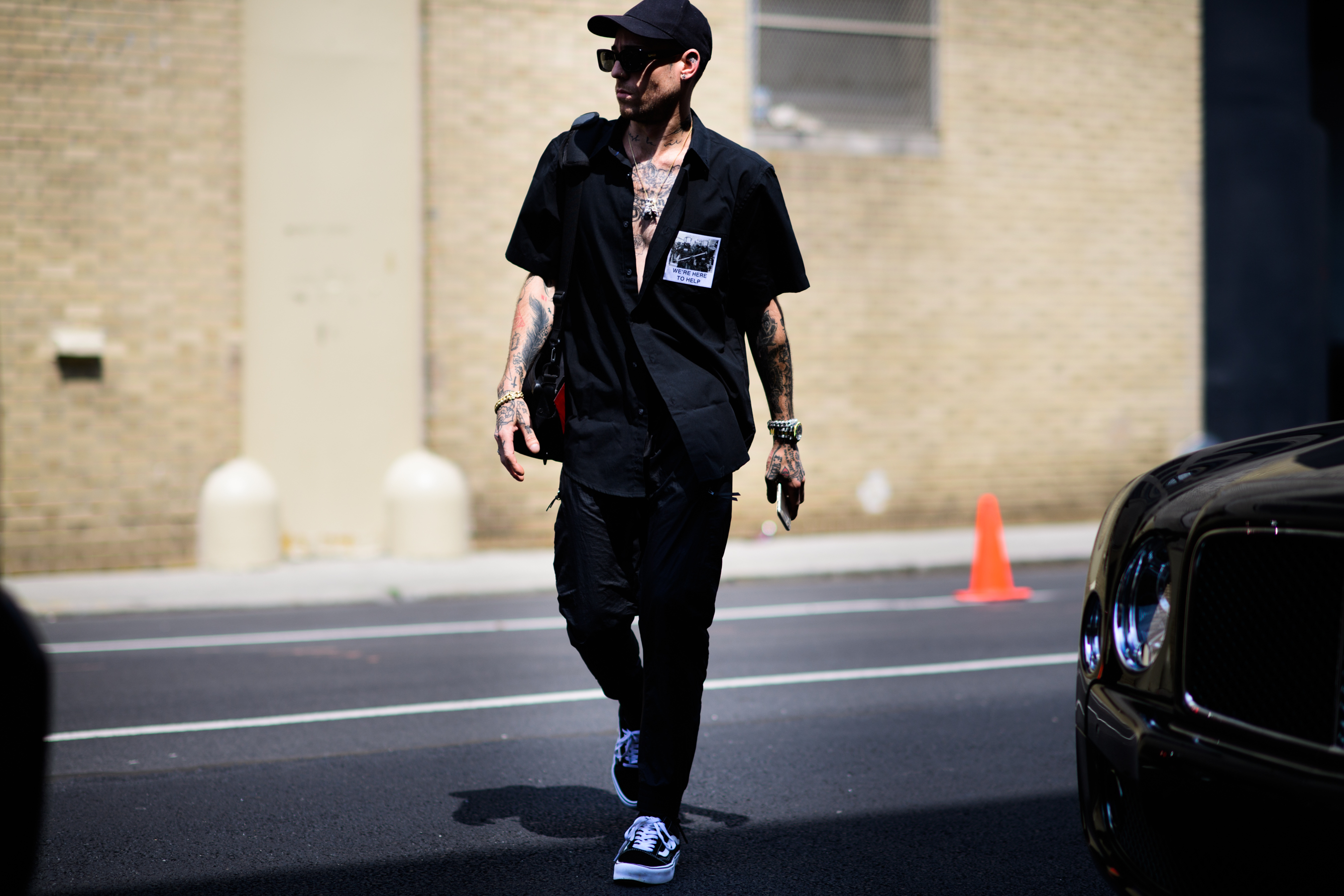 Man wearing 424 black jumpsuit