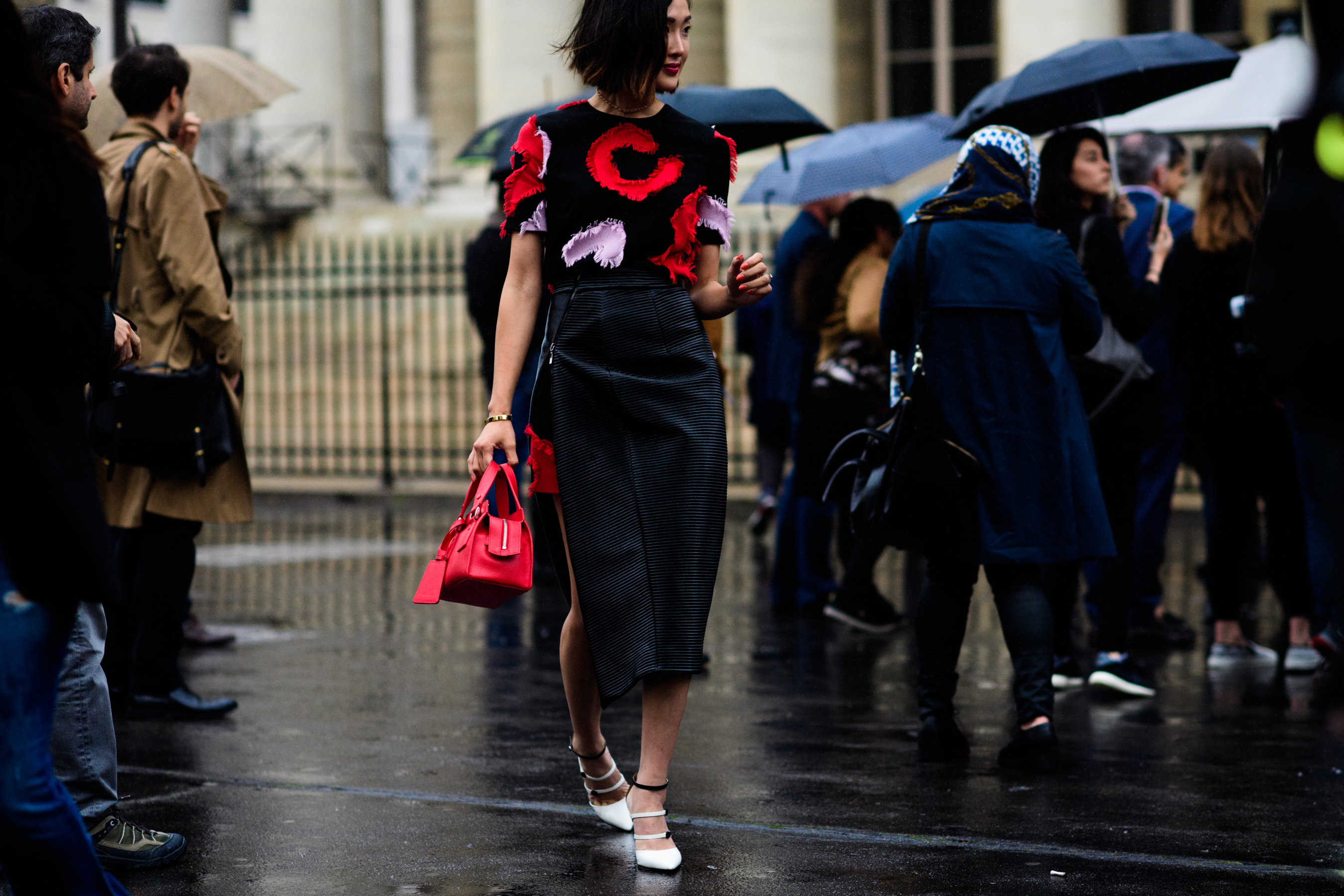 Woman with bright red handbag