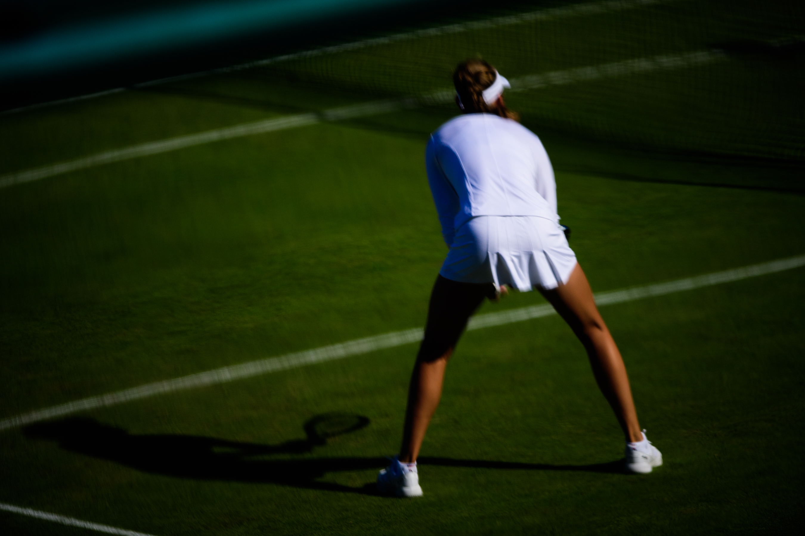 Female tennis player wearing white
