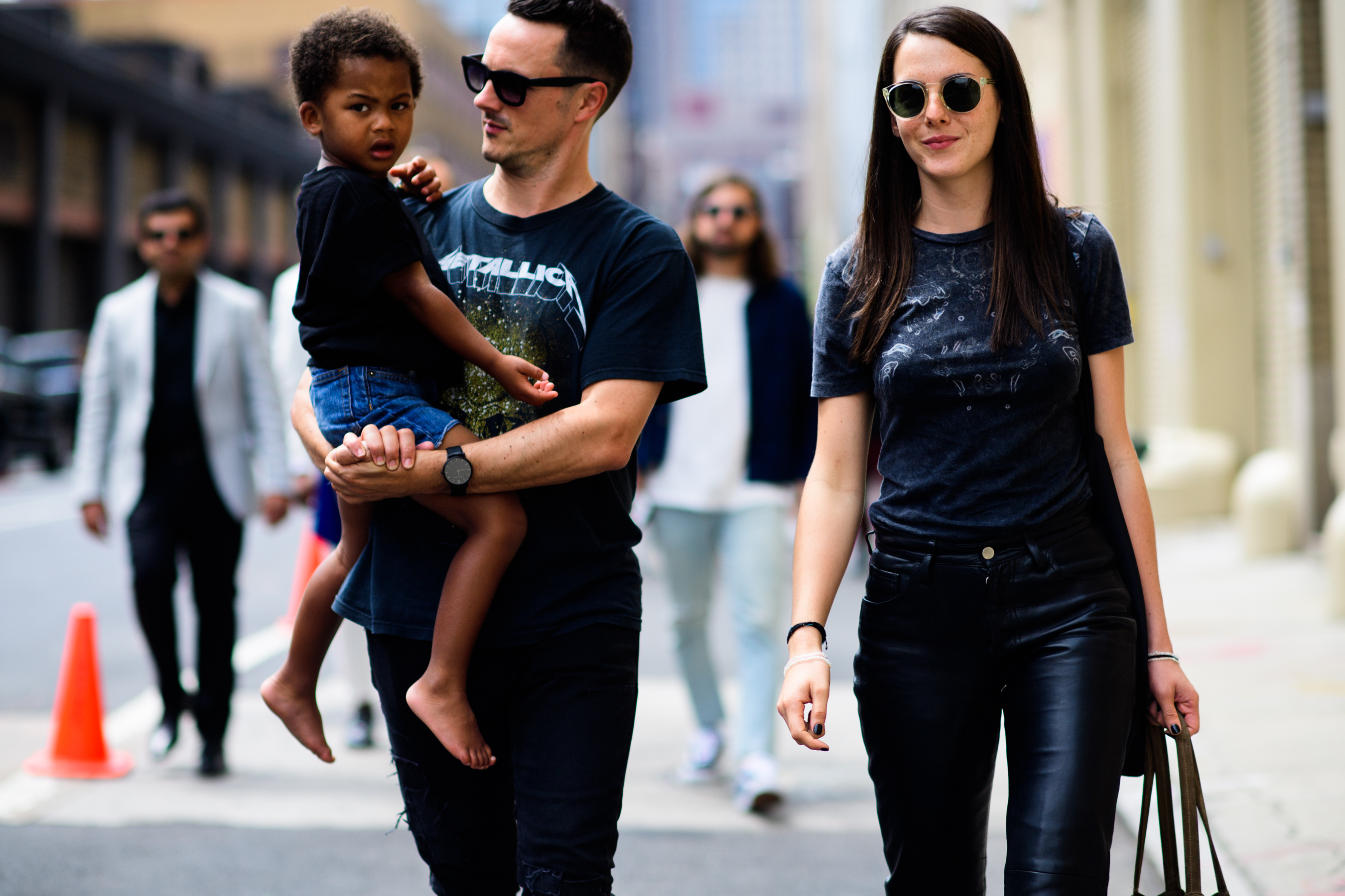 Couple holding their child after show