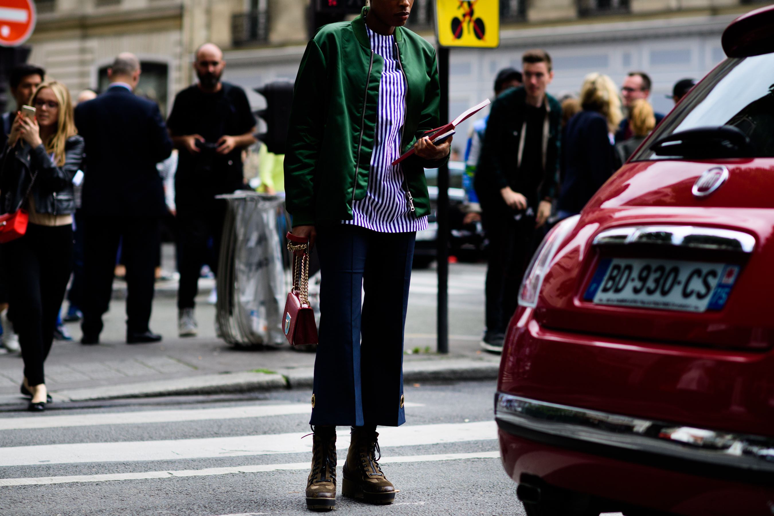 Woman with burgundy handbag