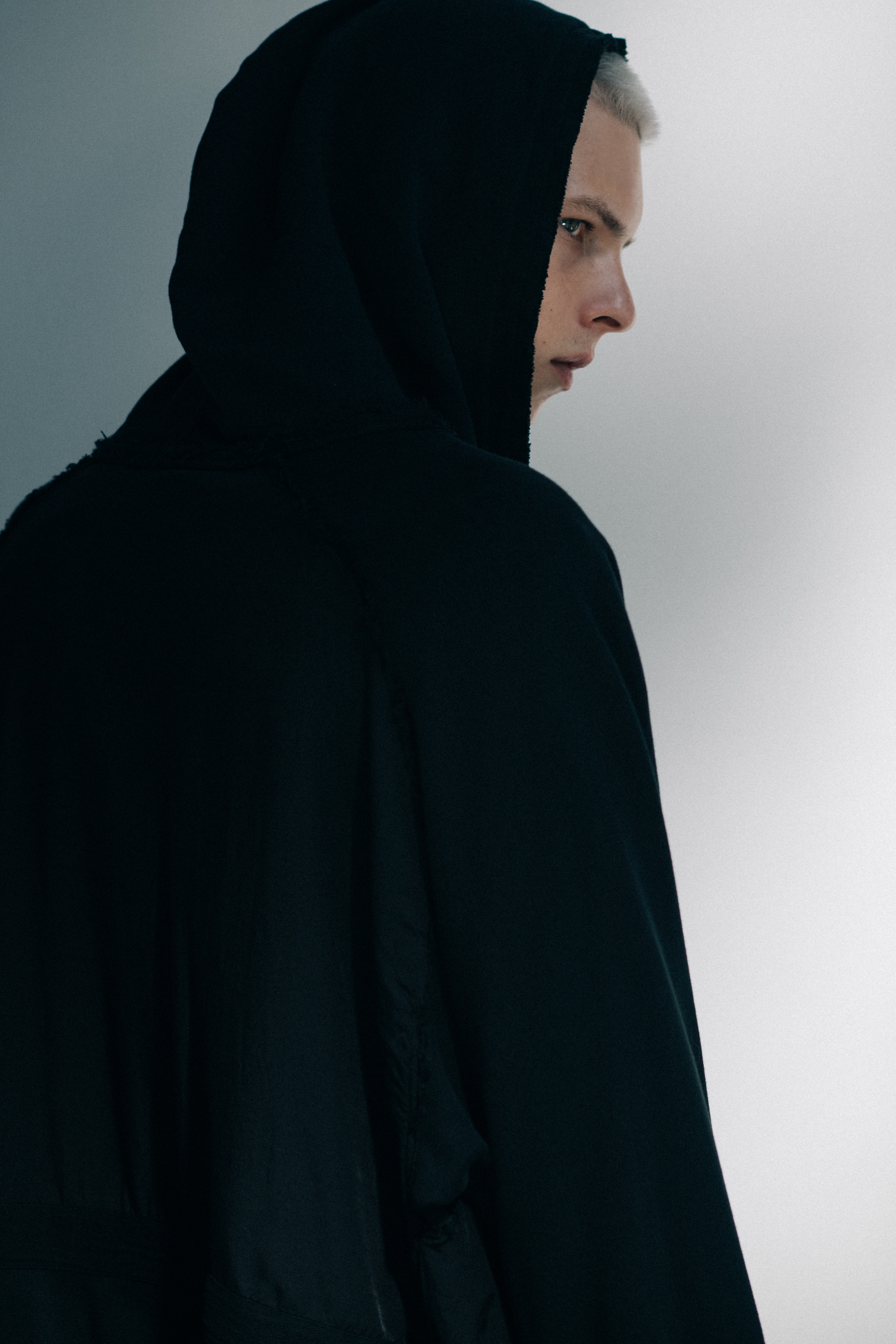 Male model wearing black hoodie