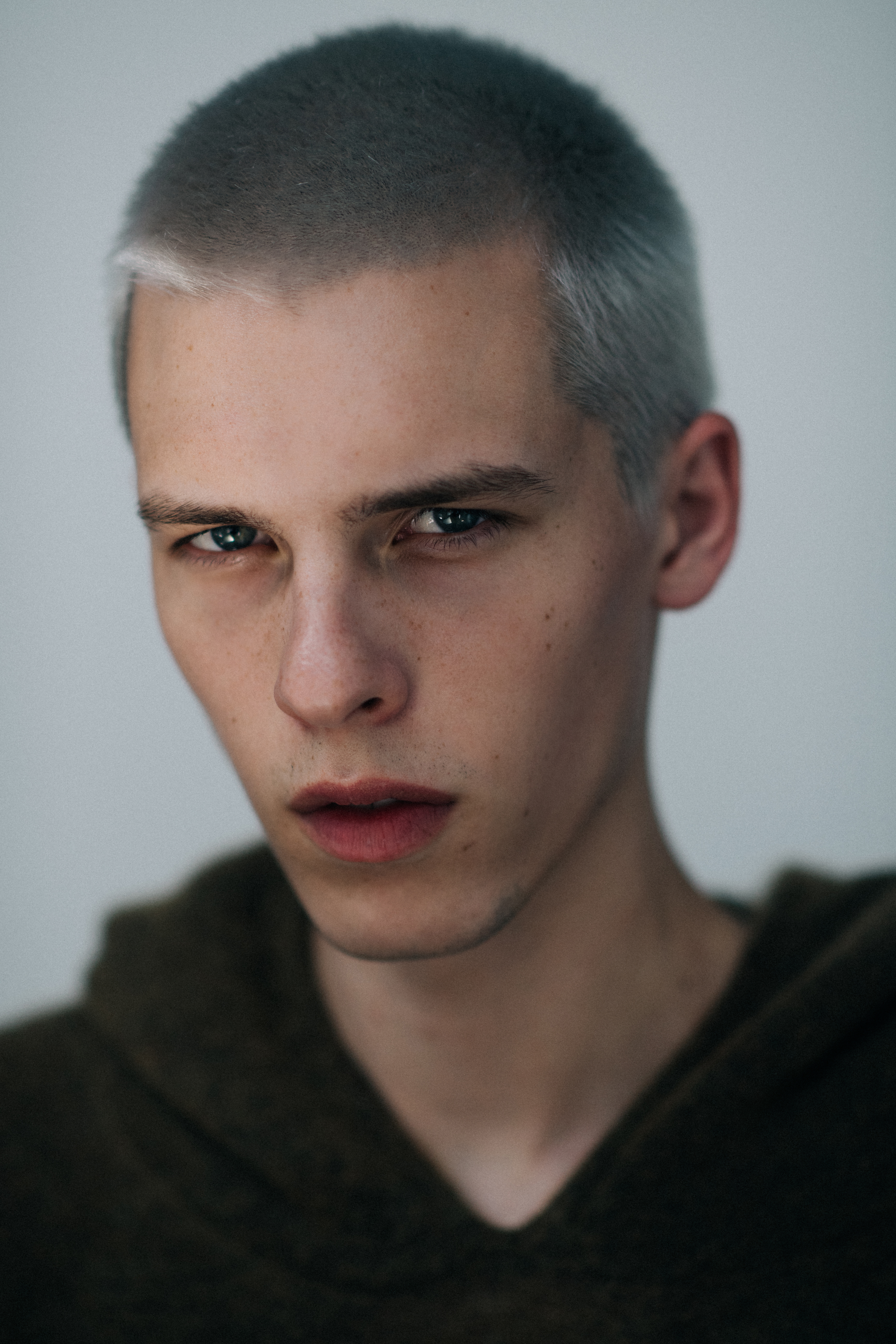 Portrait of male model with white hair