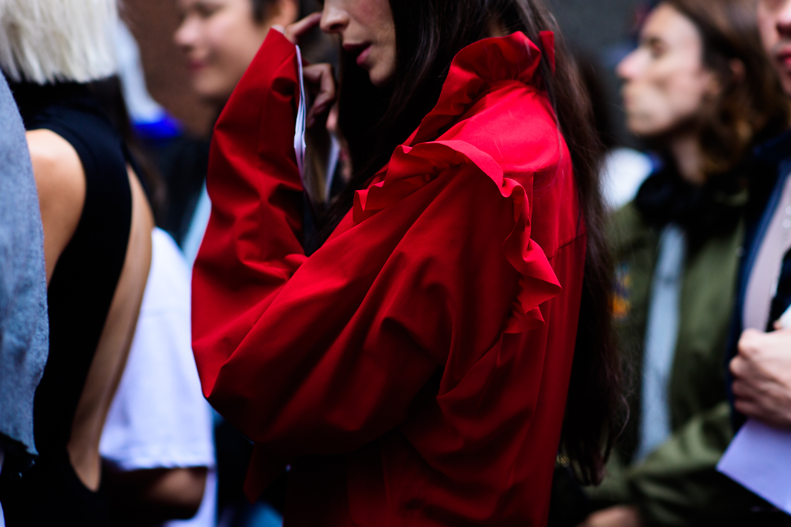 Woman wearing bright red coat