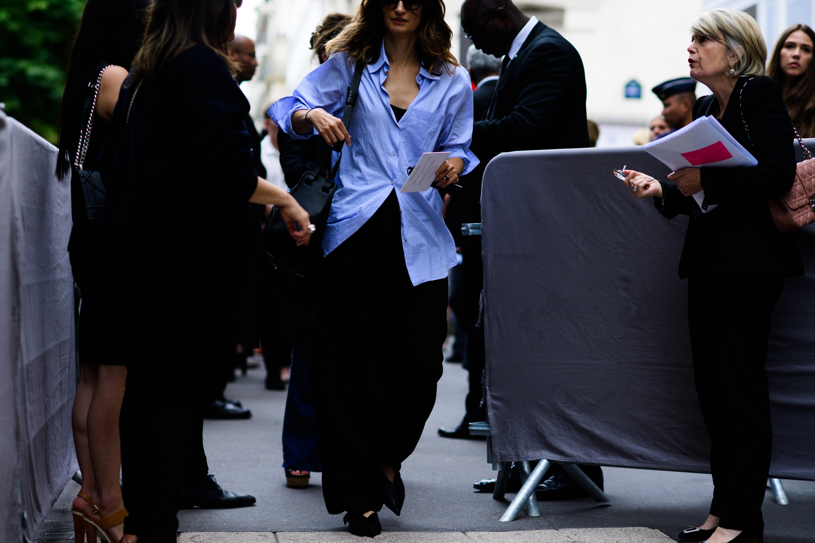 Woman wearing long blue blouse