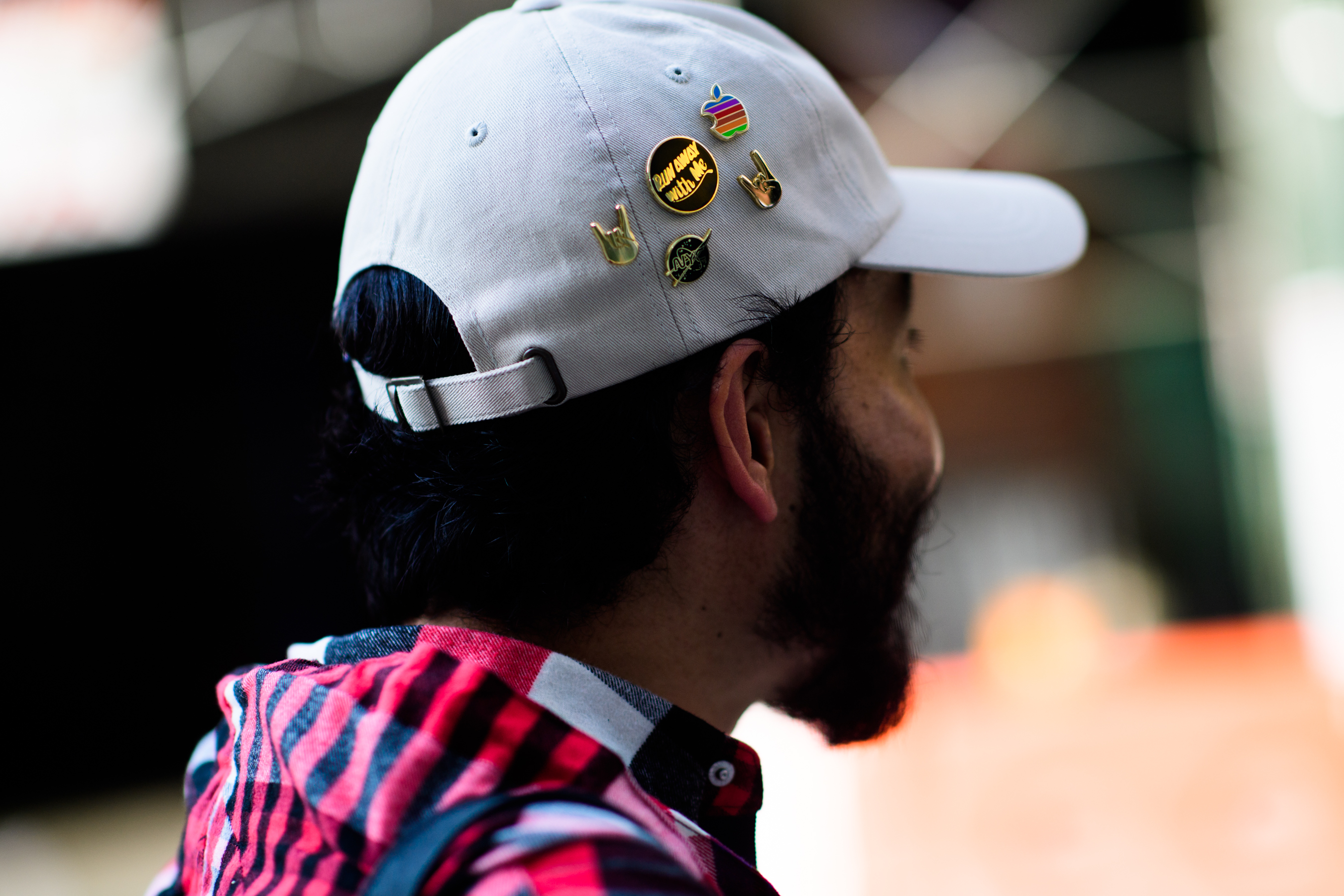 Japanese man wearing cap with pins