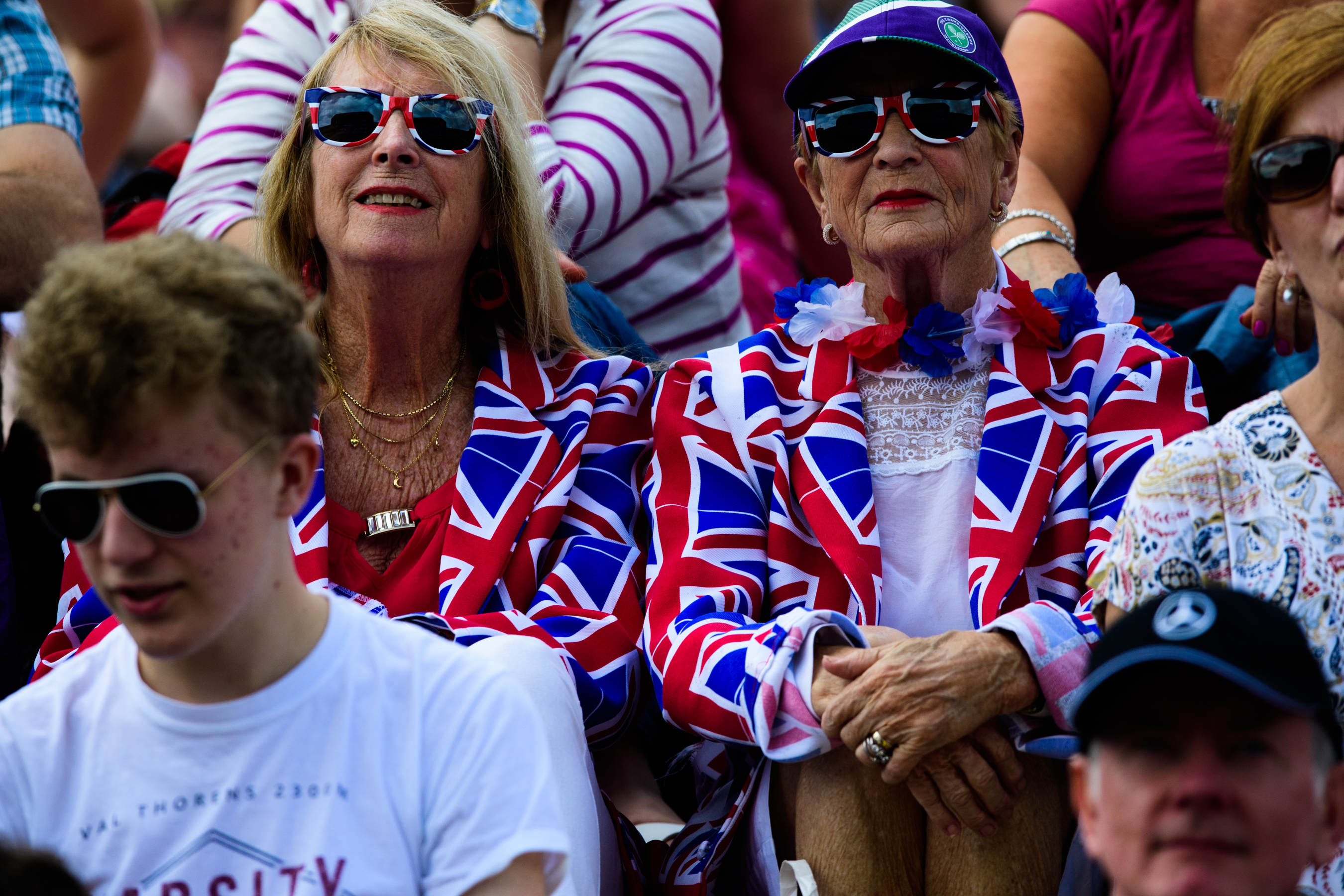 Two ladies dressed in British outfits