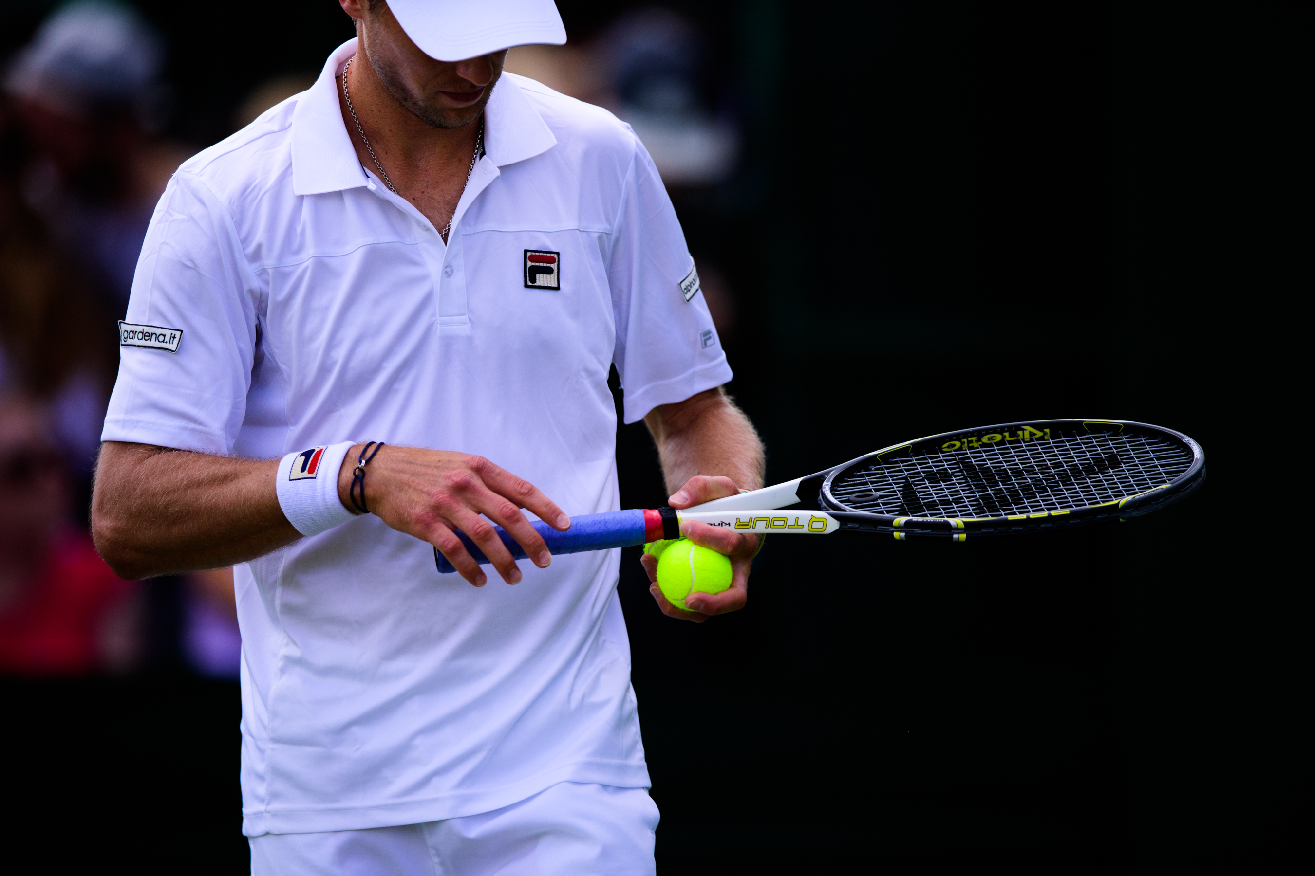 Professional American tennis player wearing white